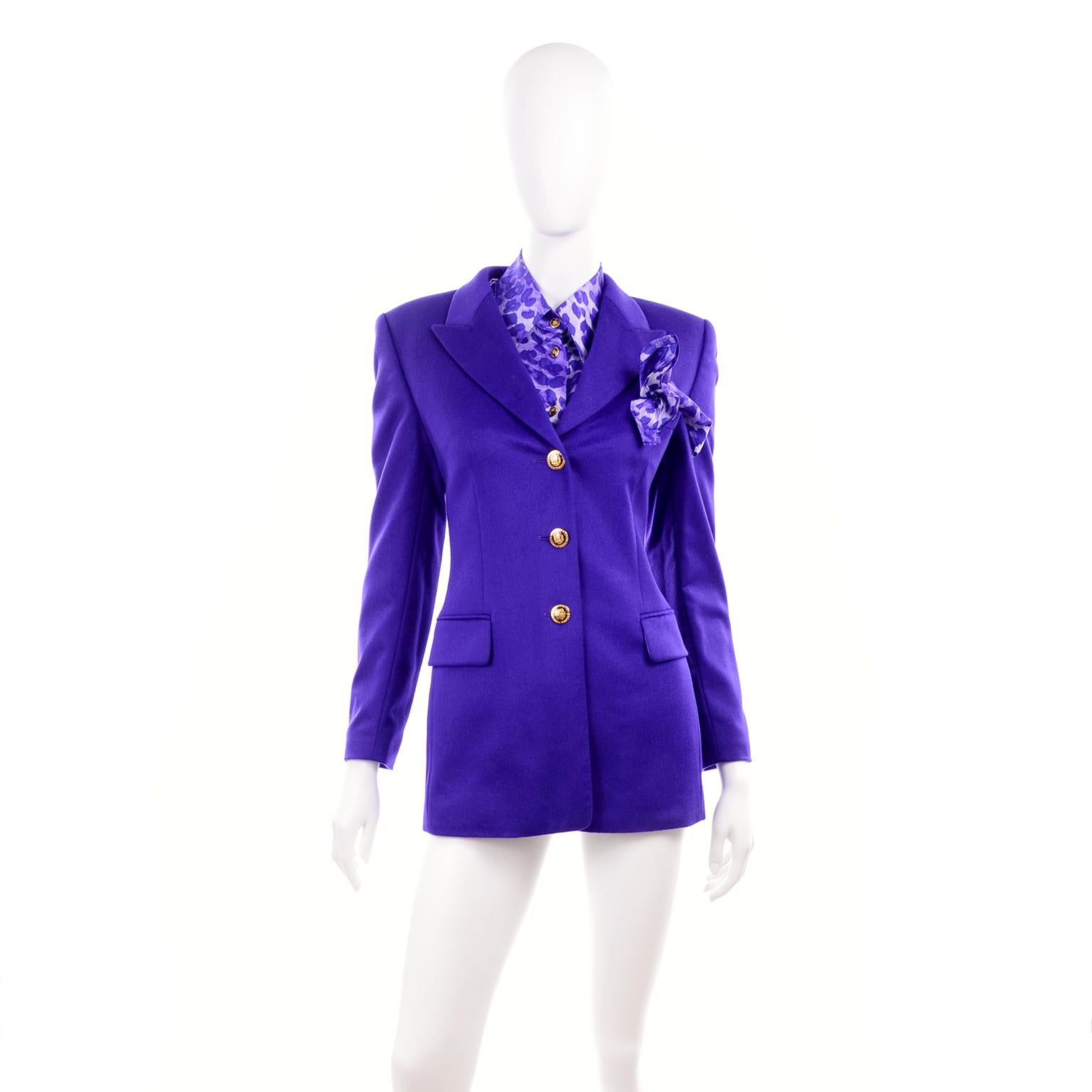 This is a 2 piece ensemble that includes a gorgeous purple rabbit fur, wool blend jacket and a purple animal print silk blouse.  The blazer has a pocket square that is in the same fabric as the blouse.  Designed by Margaretha Ley, this This