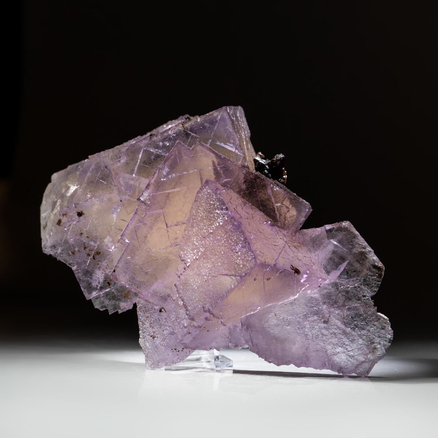 from Elmwood Mine, Carthage, Smith County, Tennessee Lustrous cubo-octahedral transparent purple fluorite crystals in a complex intersecting formation with faint yellow core. The fluorite crystals have glassy cubic faces with stepped growth