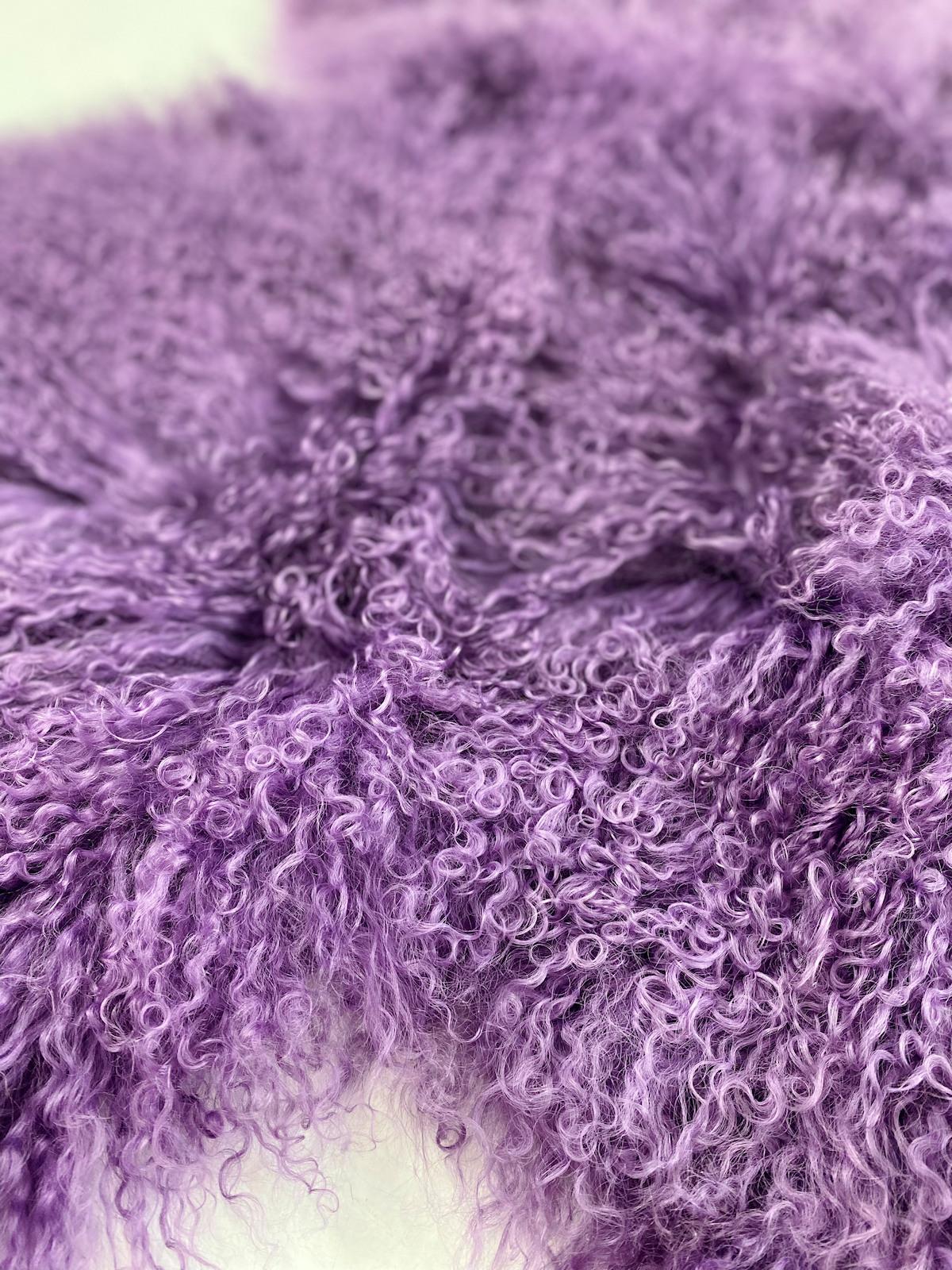 From alluring softness to sustainable and organic design, this purple fur rug hand-crafted from genuine Mongolian sheepskin translates modern and stylish design paralleled with an expression of natural signature living. 

Featuring an eclectic