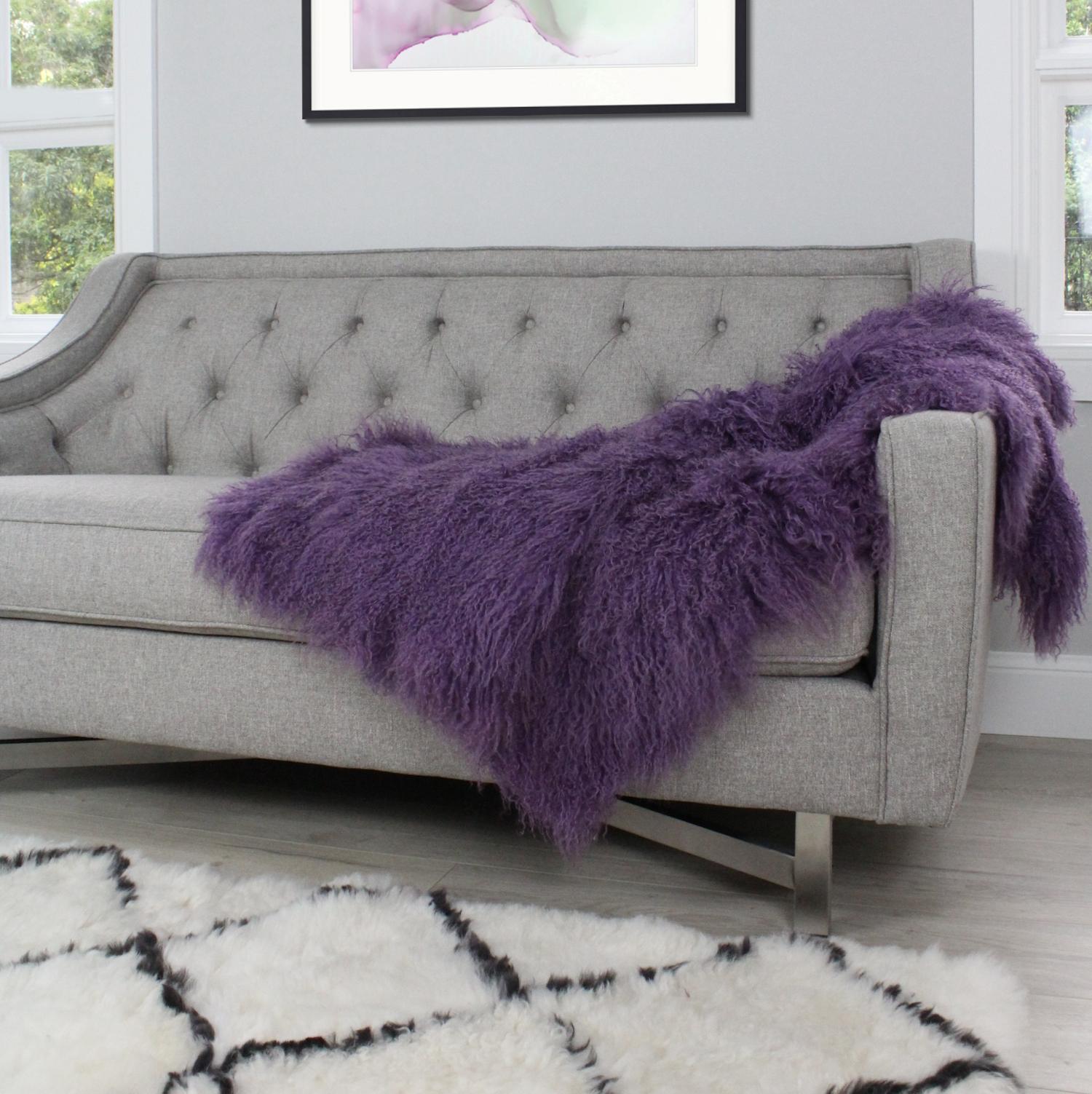 This super luxe purple fur throw will add luxurious elements to your décor. Whether styling a chair, sofa or bed, the lush and real fur throw blanket will instantly revamp a décor as the curly / crimp fur like wool drapes elegantly on any piece of