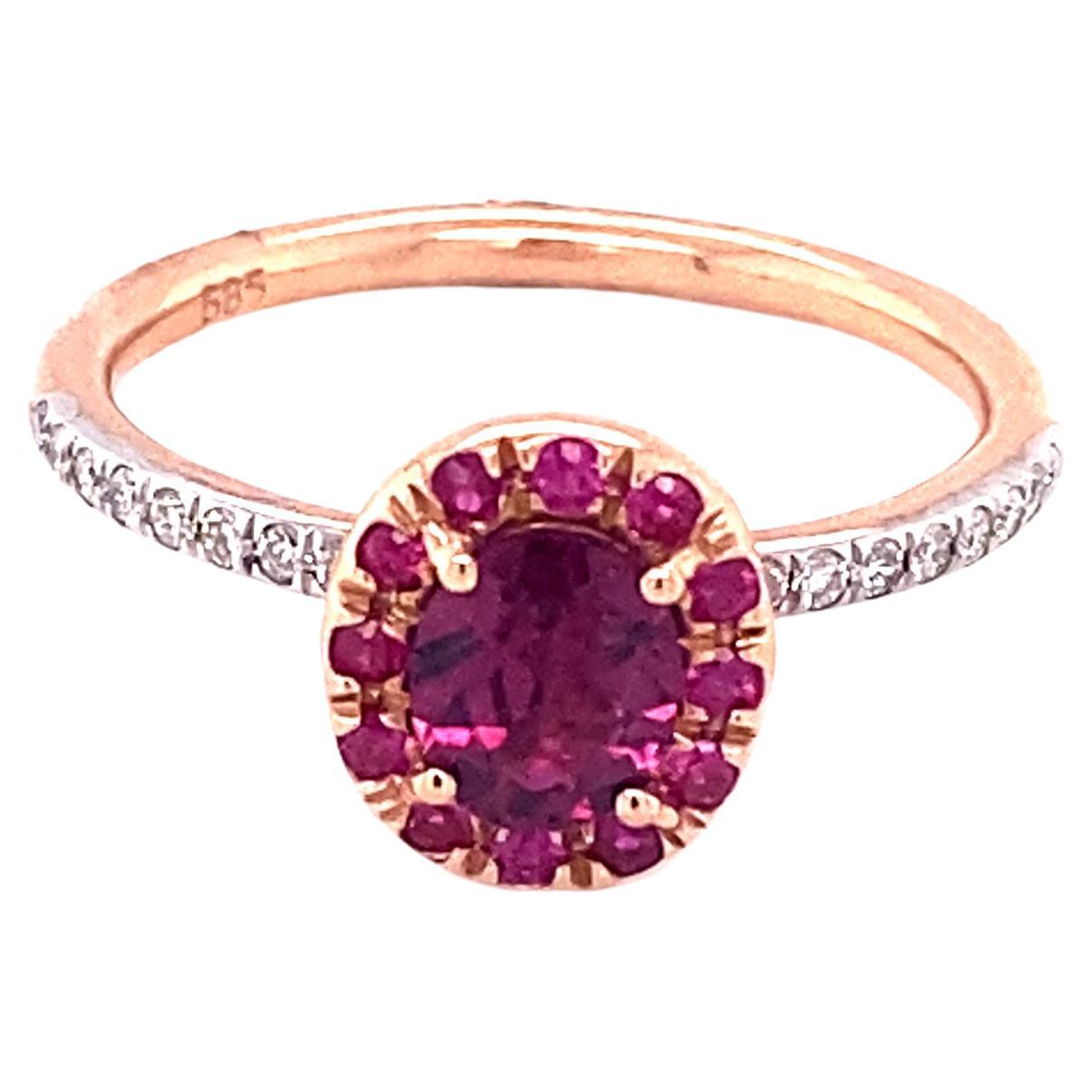 A ring with garnet, ruby, and diamonds? I think it is a beautiful combination of gemstones! That is exactly what we did with this ring! The center stone is a purple garnet, the halo has marvelous red rubies, and the shank has amazing white diamonds!