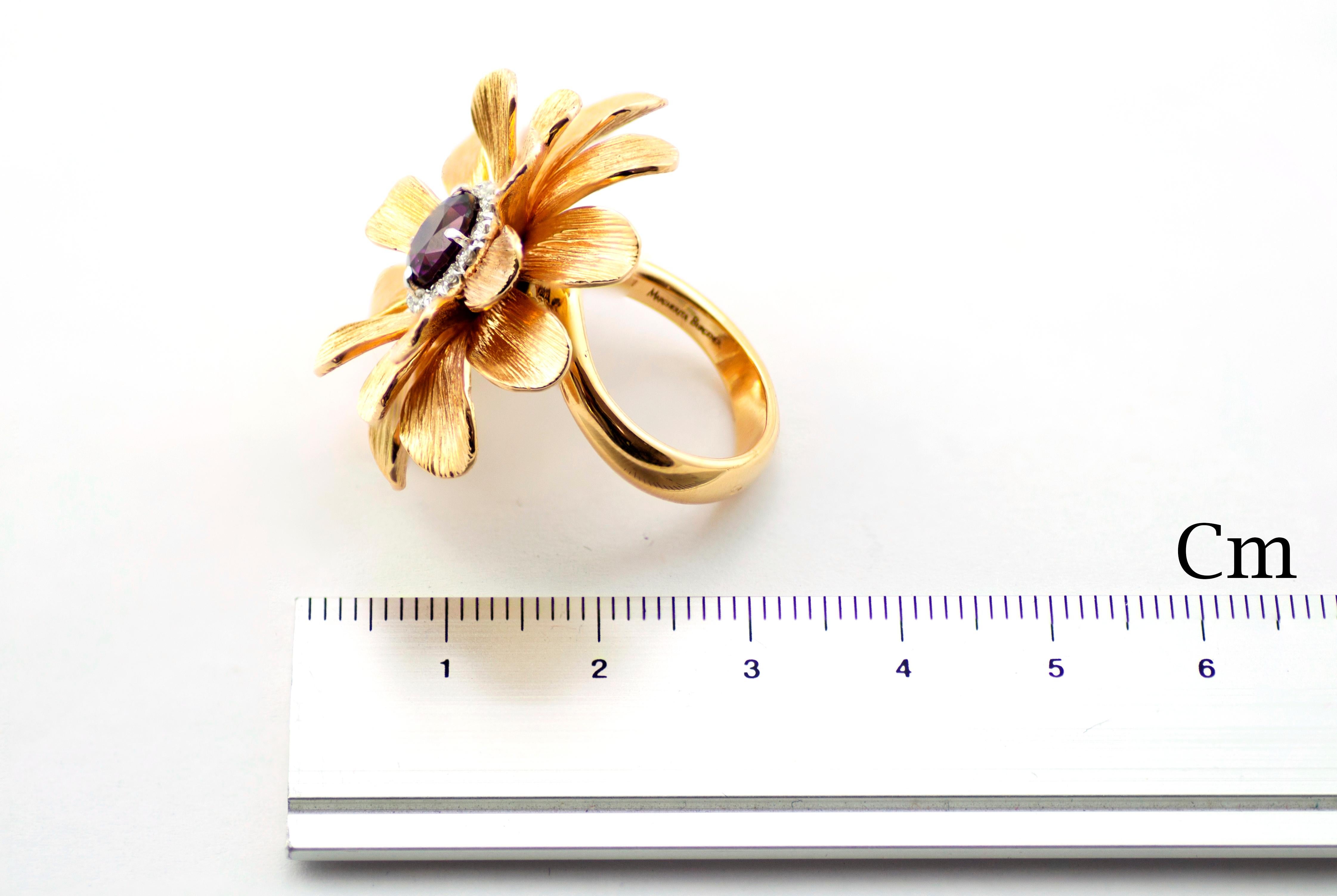 The Happy Flower ring had been handcrafted in Margherita Burgener family workshop, Italy.
Beautifully engraved by burin, each petal looks like real flower ones.
Pink gold matches perfectly the purple of the central stone, a special natural