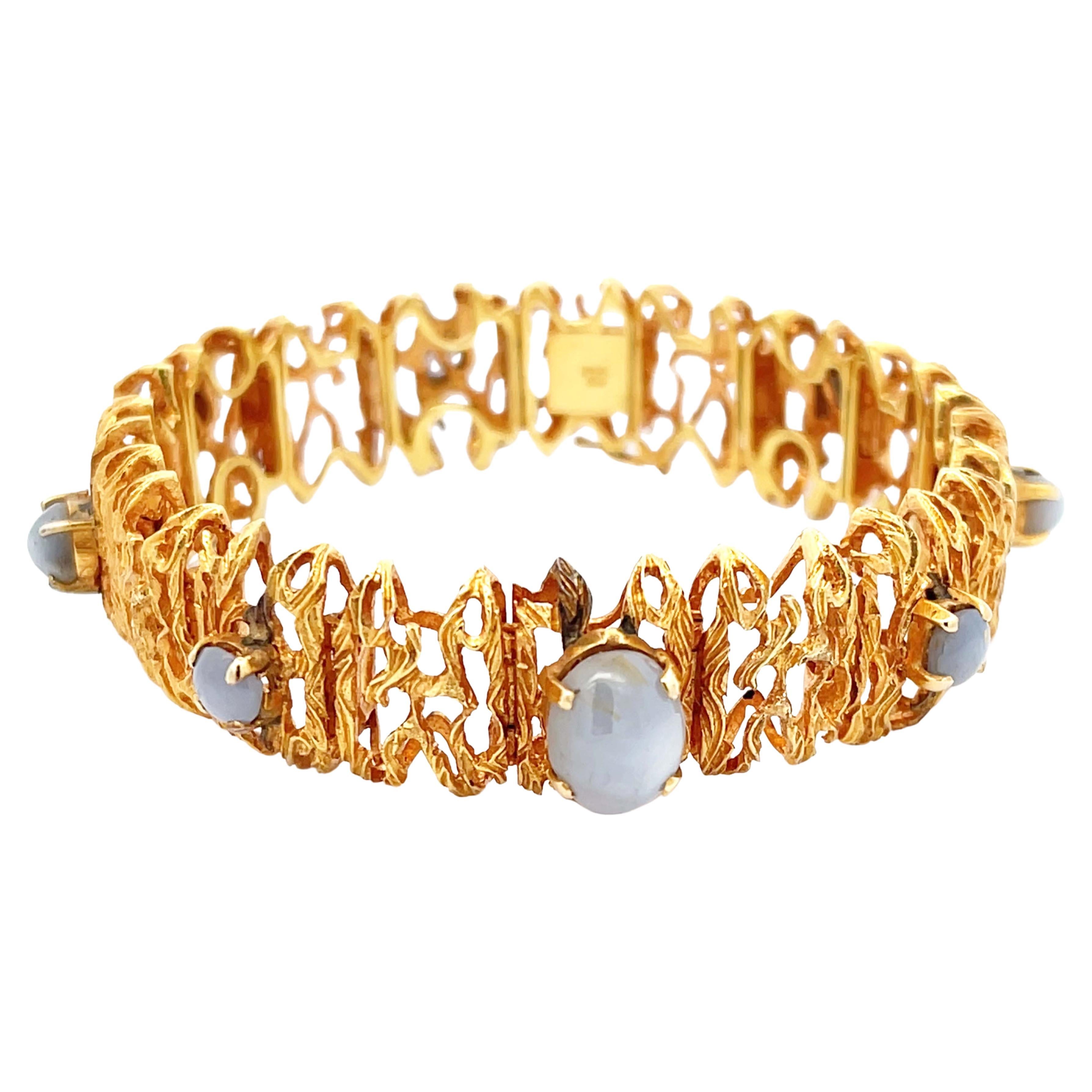 Statement-Armband mit lila grauem Sternsaphir aus 18k Gelbgold im Angebot