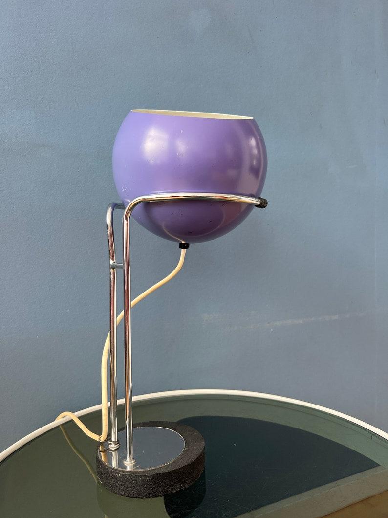 Rare purple space age eyeball desk lamp by the Dutch company Herda. The shade can be positioned in any way desirable (up, down, left, right). The lamp requires an E27 bulb and currently has an European plug (easily used with plug-converter in US and