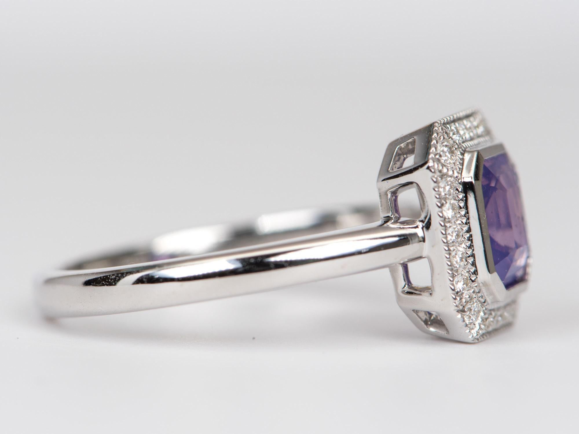 ♥  Solid 14K white gold ring set with a pinkish purple sapphire and a diamond halo
�♥  This is a very unique sapphire with a slight milkiness, presenting an opalescent effect
♥  The sapphire has some black inclusions. This is clearly shown in the
