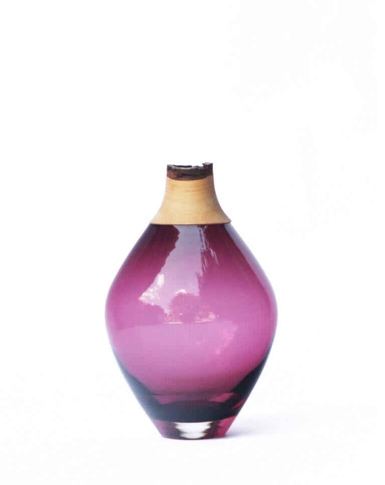 Purple Matisse stacking vessel III, Pia Wüstenberg
Dimensions: D 11 x H 21
Materials: glass, wood
Available in other colors.

The Matisse Stacking Vessels are treasures, small splashes of curvy glass with a wooden crown. The collection was