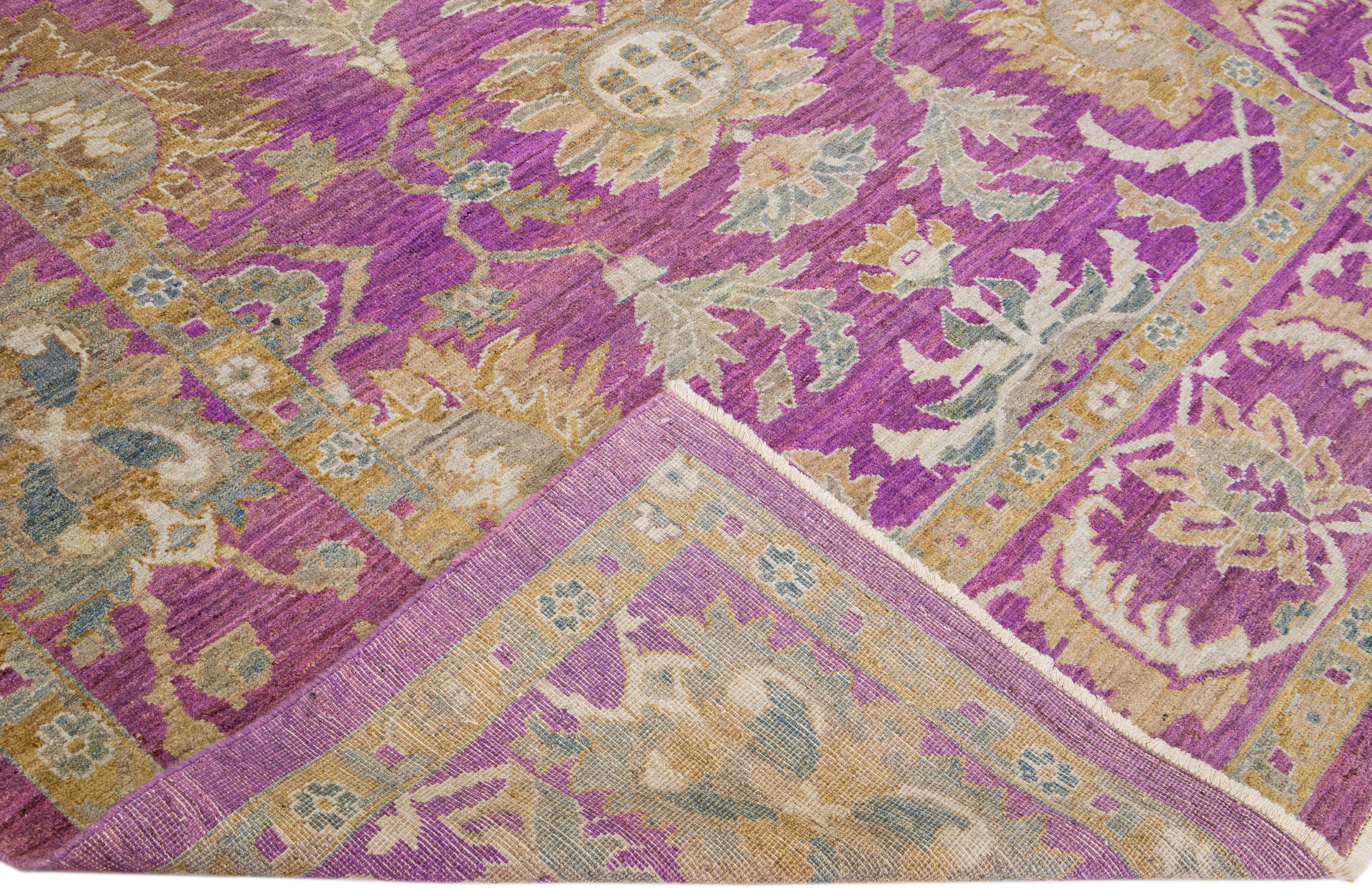 Beautiful hand-knotted Modern Mahal wool rug with the purple field. This Persian rug has ivory and brown accents featuring an all-over traditional floral pattern design. 

This rug measures 8' x 10'6