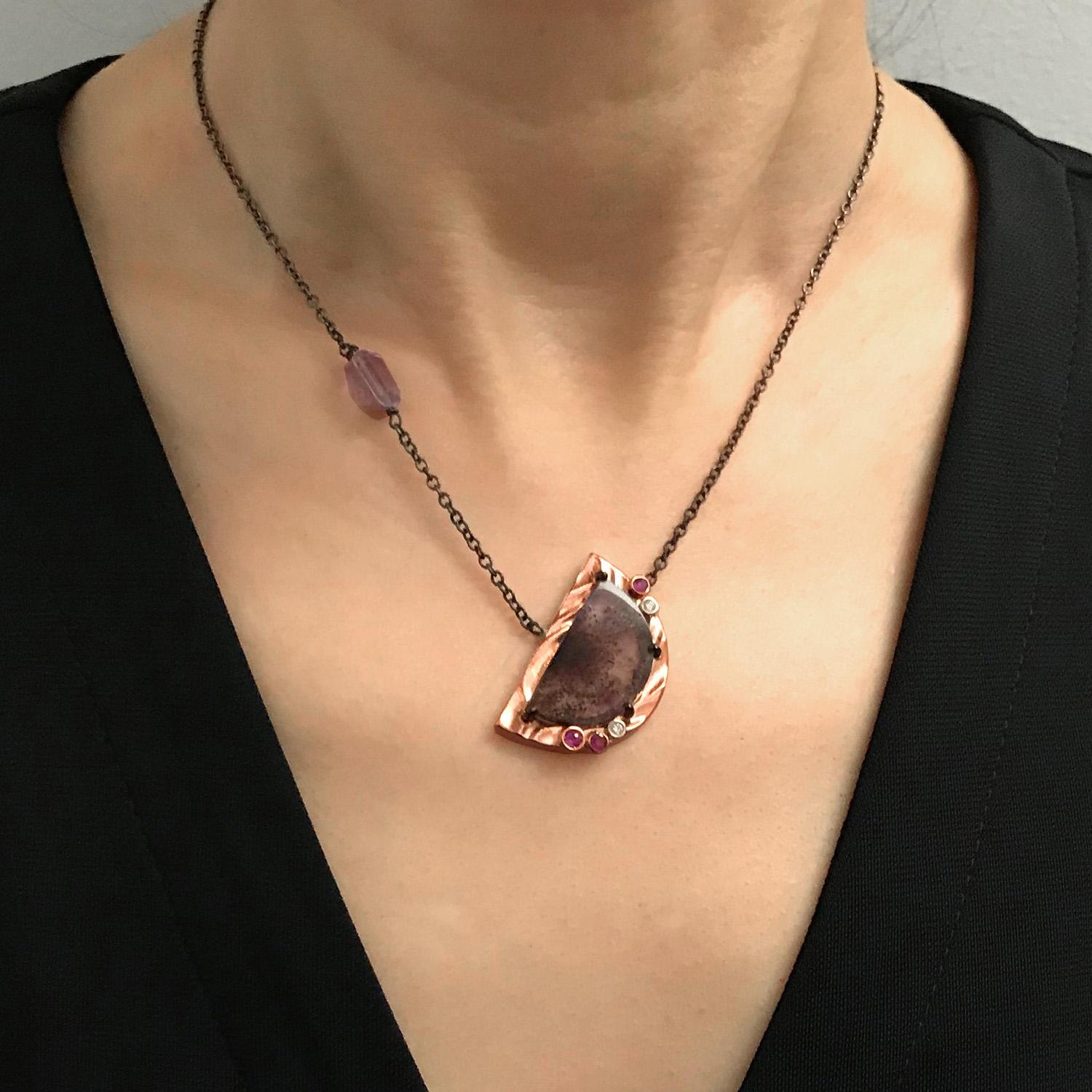 K.Mita’s remarkable Purple Moon Pendant, which is created from a half-moon shaped cacoxenite amethyst quartz with beautiful natural inclusions, is surrounded by a rim of 14k rose gold with K.Mita’s distinctive Sand Dune texture and accented with