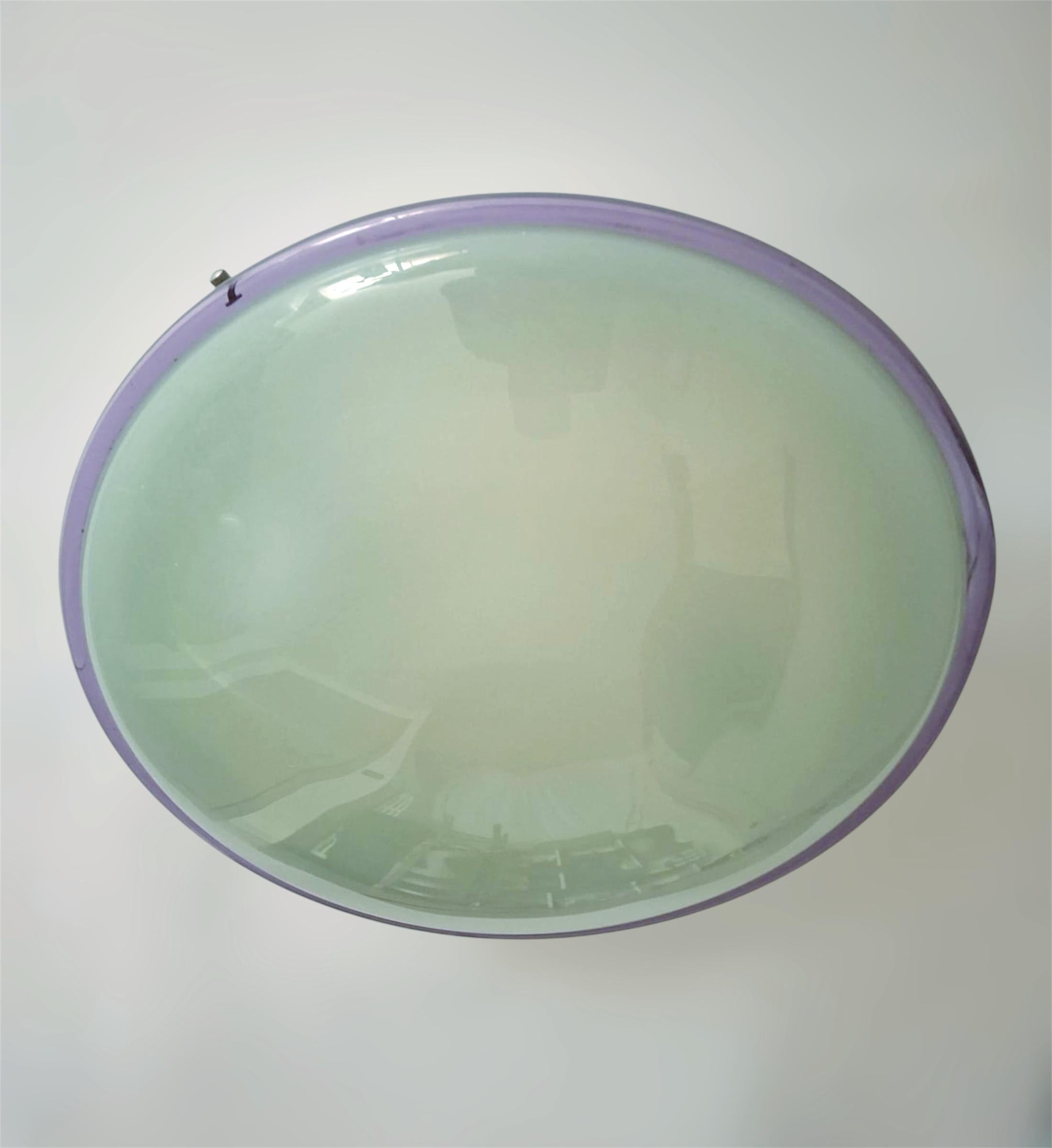 Vintage Italian flush mount or wall light with a frosted light gray green Murano glass shade enclosed in purple border / Made in Italy in the style of Venini, circa 1960s
Measures: diameter 16 inches, height 5.5 inches
2 lights / E26 or E27 type /