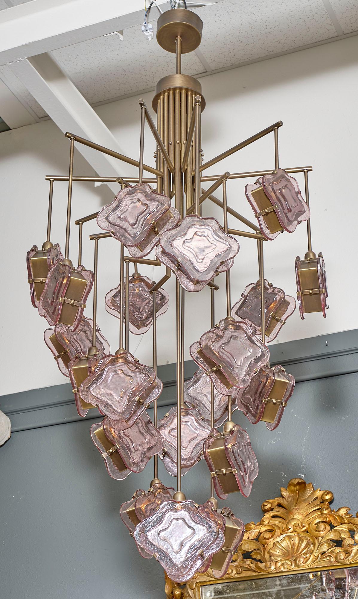 Purple Murano glass and bronze chandelier from Italy featuring an intricate structure supporting cubic components of organic; hand-blown molded glass in purple tones with solid brass encasing the sockets. It has been newly wired to fit US