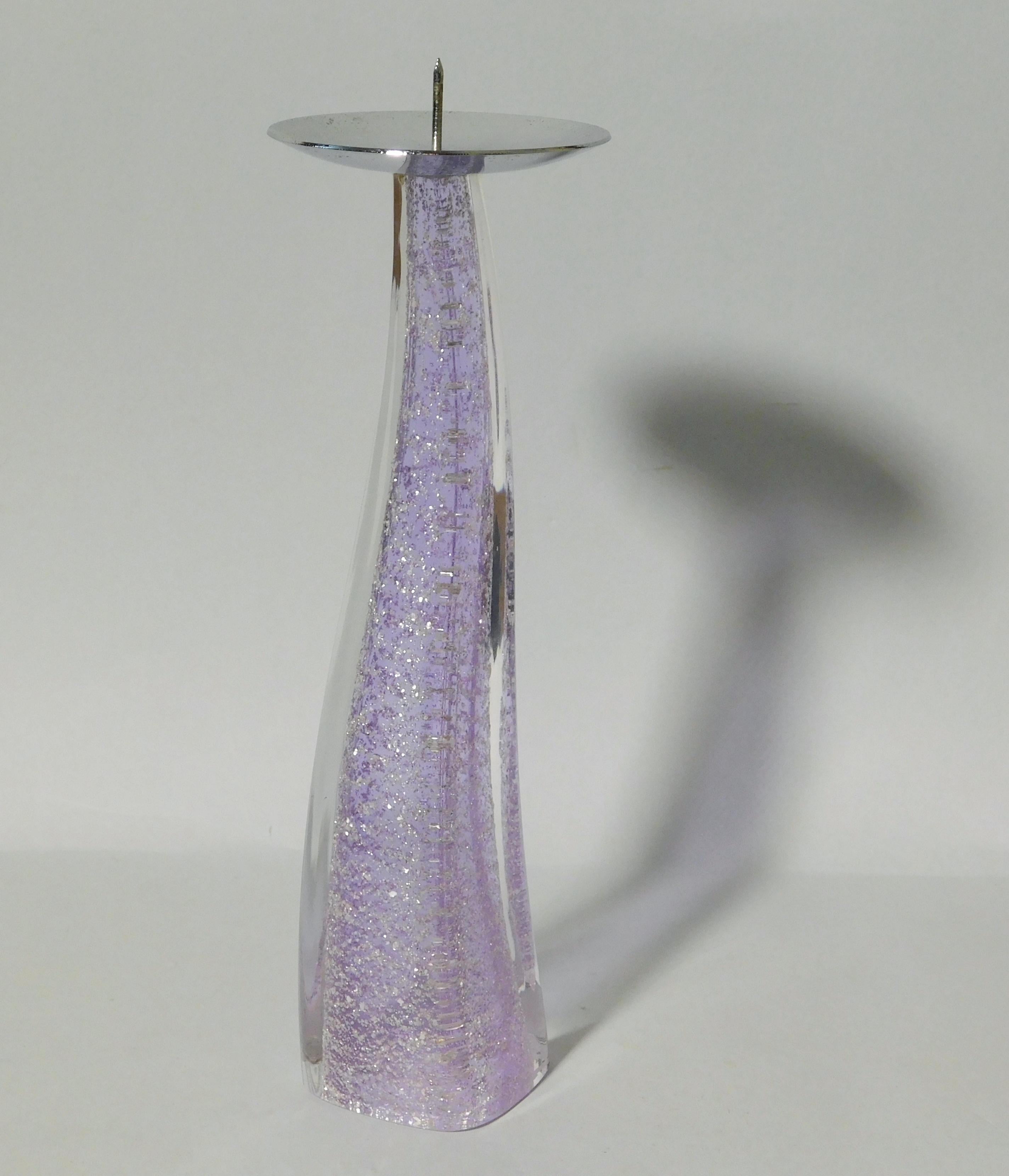 Italian curved Murano candlestick hand blown in lilac purple and clear glass infused with silver specks, made in Italy circa 1980s 
Measures: height 9 inches, diameter 2.5 inches
1 available in stock in Italy
This piece makes for a great and unique
