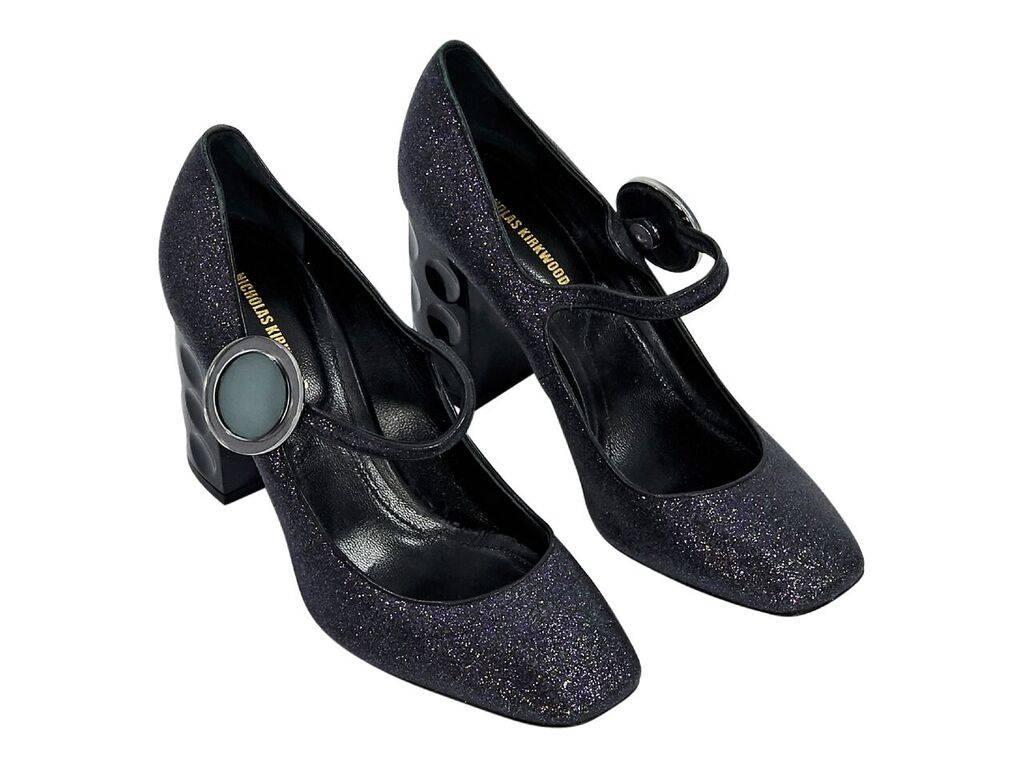 Product details:  Purple glitter Mary Jane pumps by Nicholas Kirkwood.  Snap strap closure.  Round square toe.  Debossed block heel.  Euro size 37.  3.5