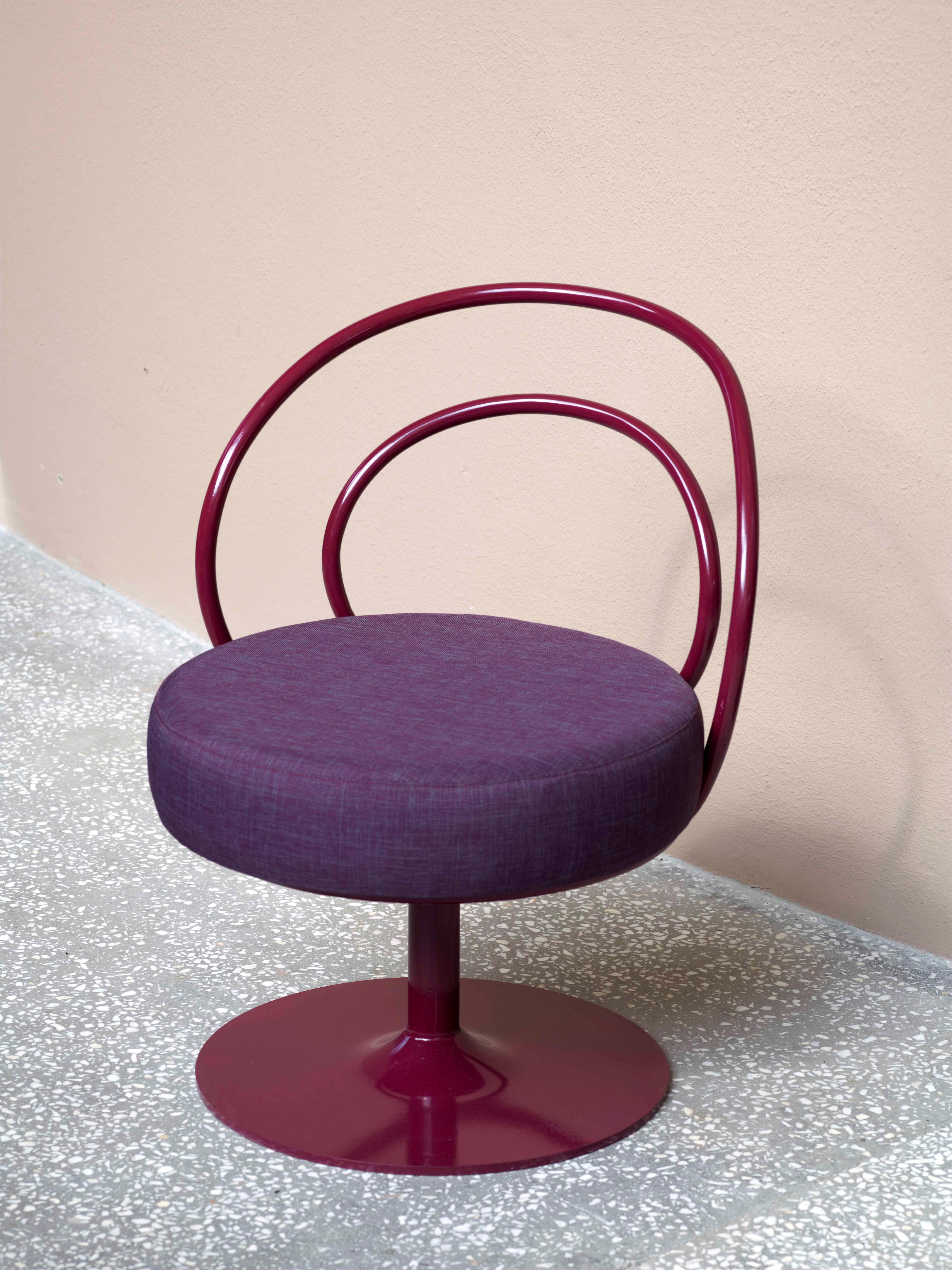 Purple O chair by Sema Topaloglu
Dimensions: 38 x 48 x 74 cm
Materials: Iron and cushion

Sema Topaloglu is known for her dedication to materials, craftsmanship and a unique aesthetic vision. The tactile and visual relations between materials,