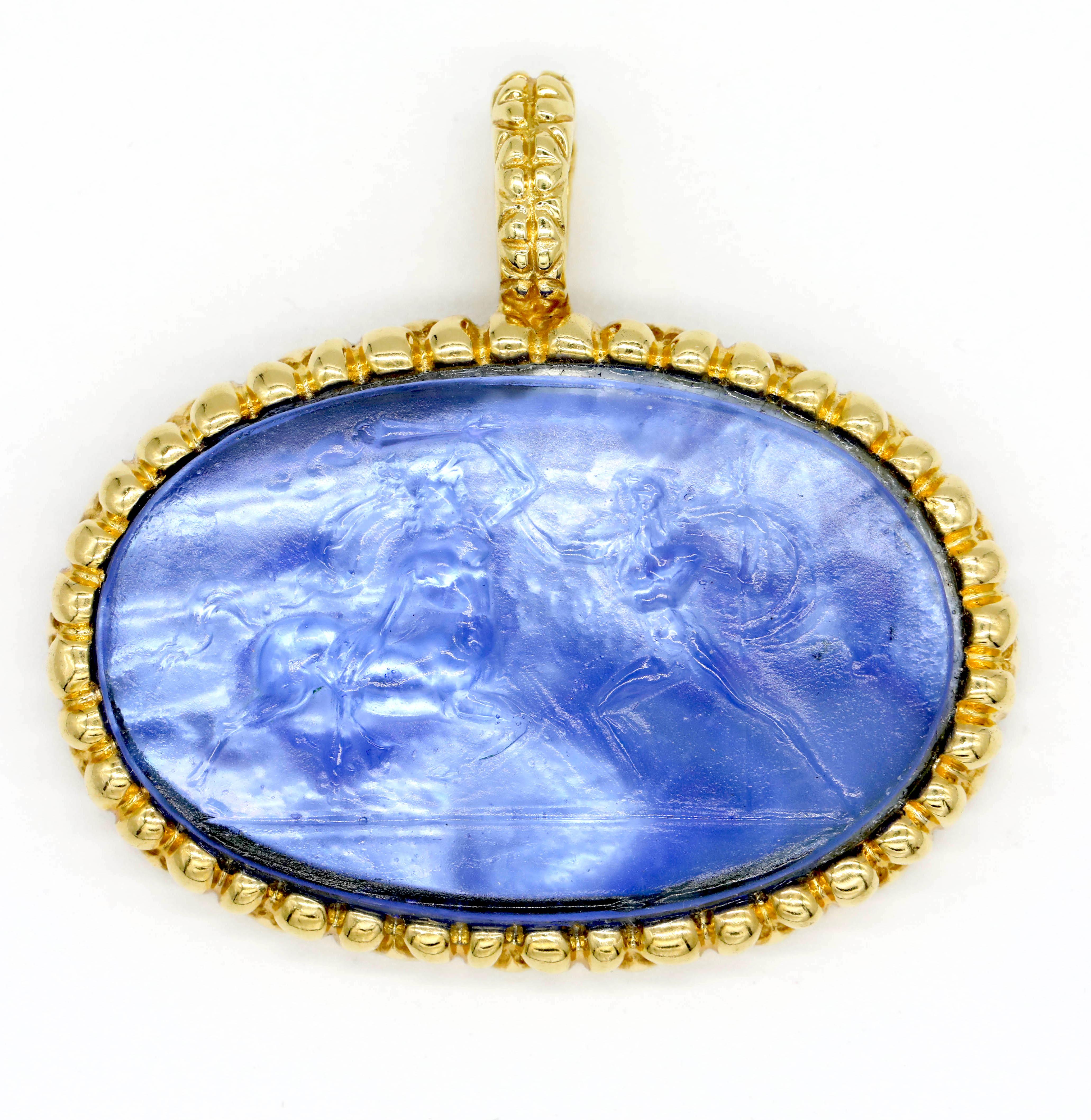 New Victorian Purple Oval Italian Murano Glass Carved Intaglio Pendant 18k Yellow Gold

A cameo, an intaglio is created by carving below the surface to produce an image in relief, with the purpose of pressing into sealing wax. Intaglios were often