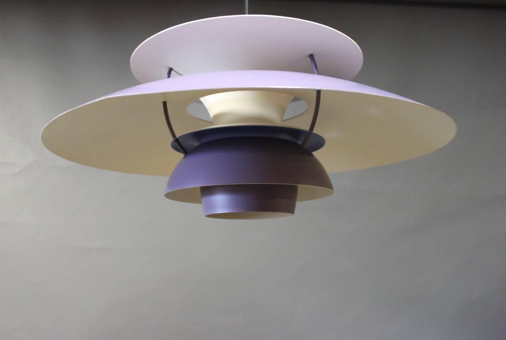 PH5 pendant designed by Poul Henningsen in 1958 and manufactured by Louis Poulsen in the 20th Century. The pendant has purple lacquered metal shades.