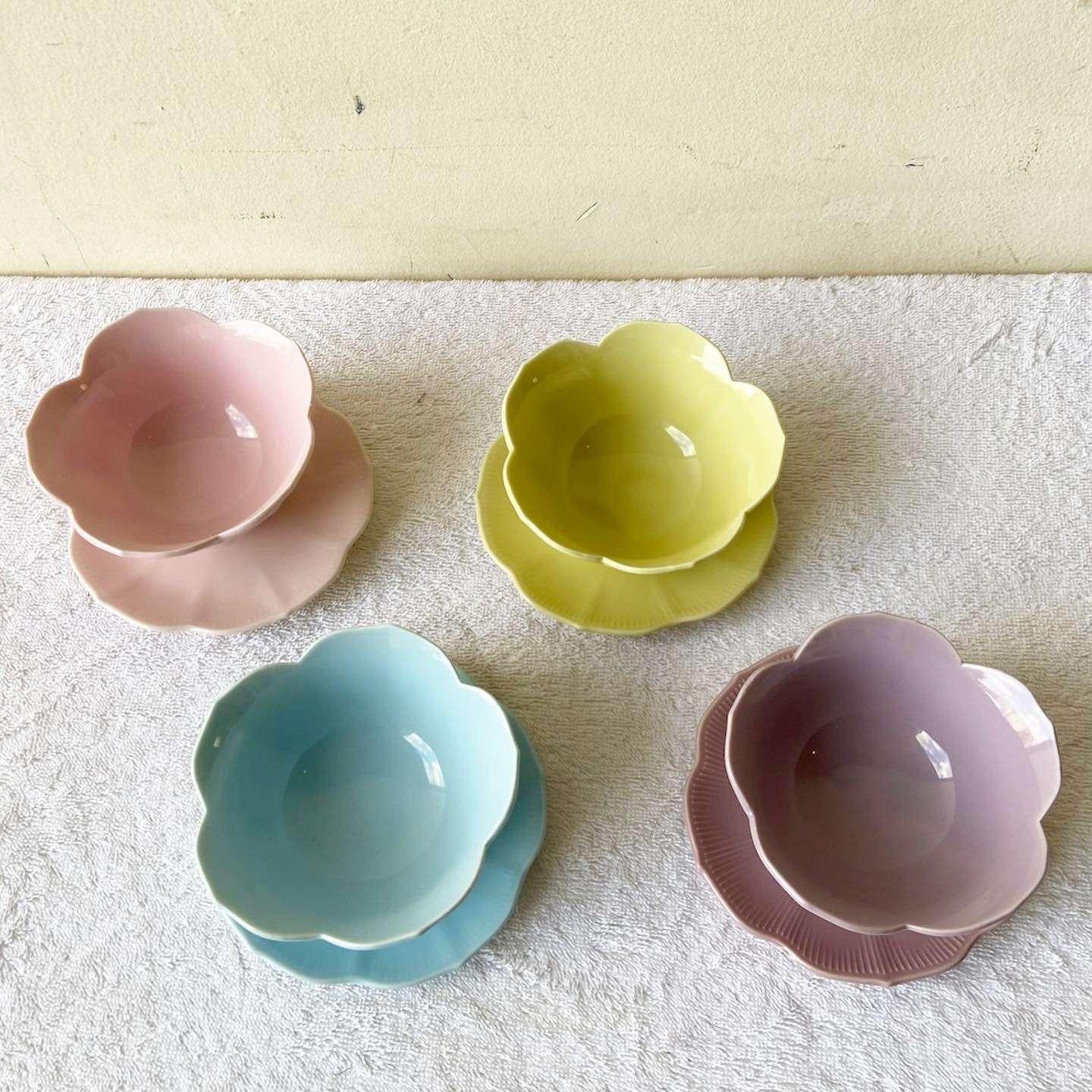 Exceptional set of 4 saucers and 4 bowls by Lillian Venon. Each bowl displays a plant shape, one in pink, purple, blue and yellow.

Bowls measure 4.5”D, 2.5”H
Saucers measure 5”D, 0.5”H