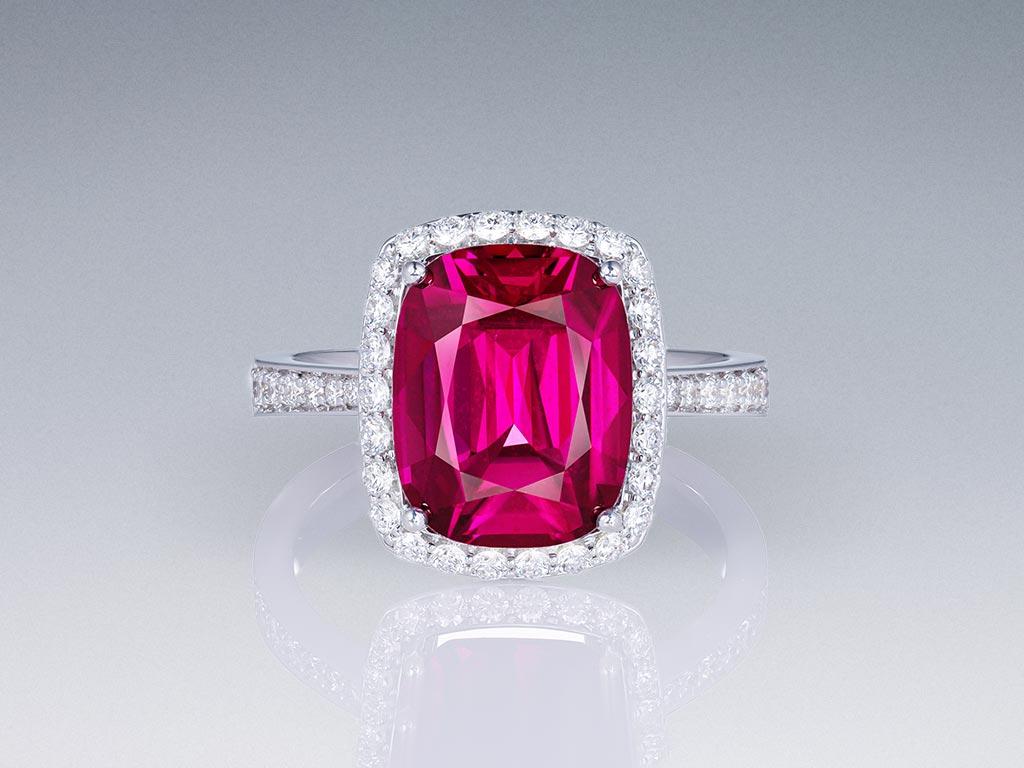 Introducing the epitome of elegance: our 5.18 carat Purple-Pink Tanzanian Rhodolite ring. Crafted to perfection, this stunning piece features a stylish cushion-cut shape, accentuating the rich hue and vibrant play of the exquisite stone.

Impeccably