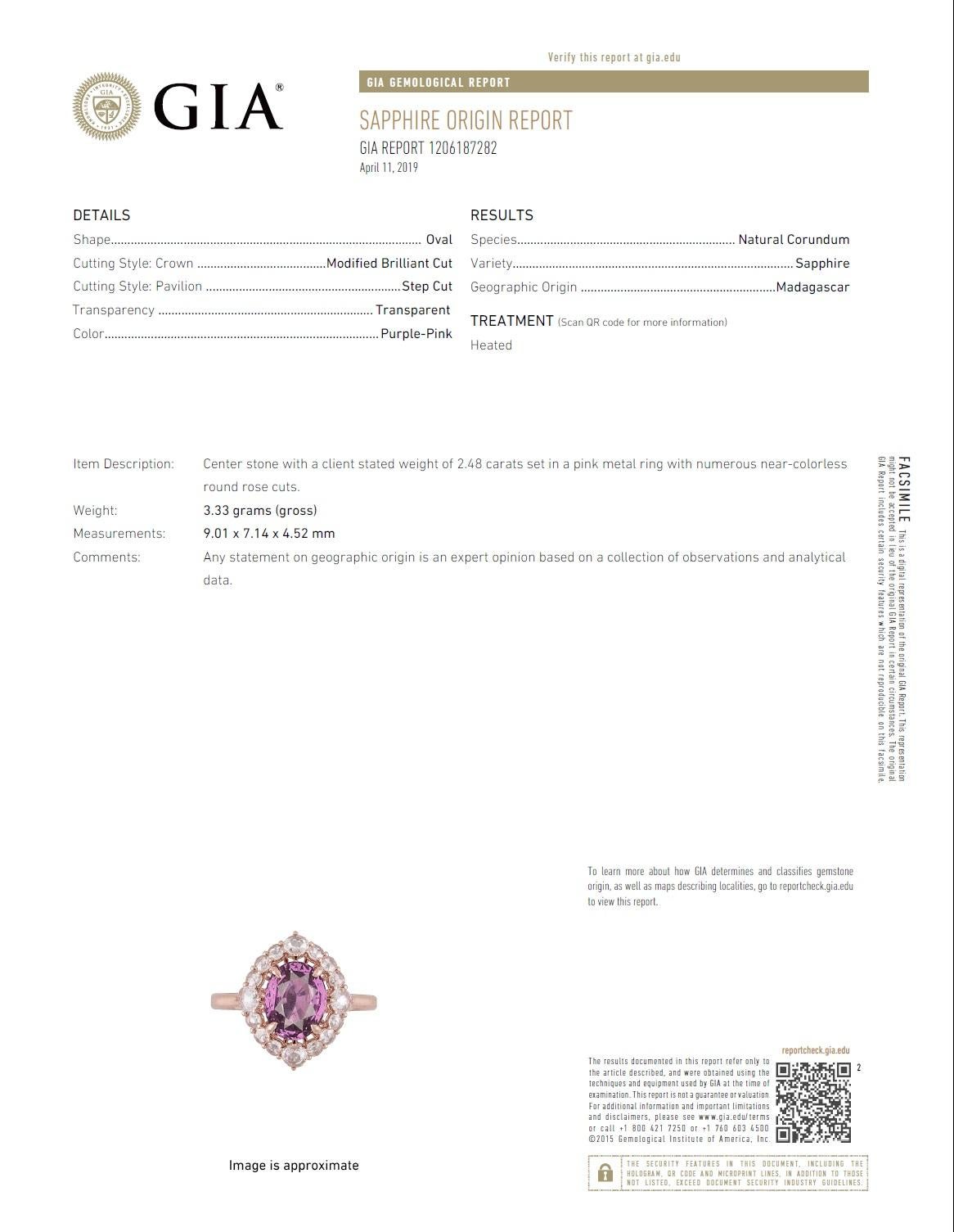 With a GIA Certified 2.48 carat oval cut exotic pink sapphire center, set inside a halo of rose cut white diamonds (total diamond weight 0.47 carats), this ring shines from every angle.

GIA Certification details (see photo):
The center sapphire is