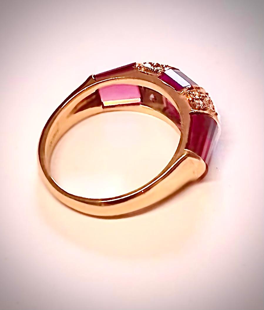 An exquisite ring of tiered richly colored purple/pink tourmaline segments separated by segments of round brilliant cut diamonds weighing approximately 0.30cts. of near colorless G-I, and SI-I clarity. Stamped “TIFFANY&CO. 18K”

This piece is very