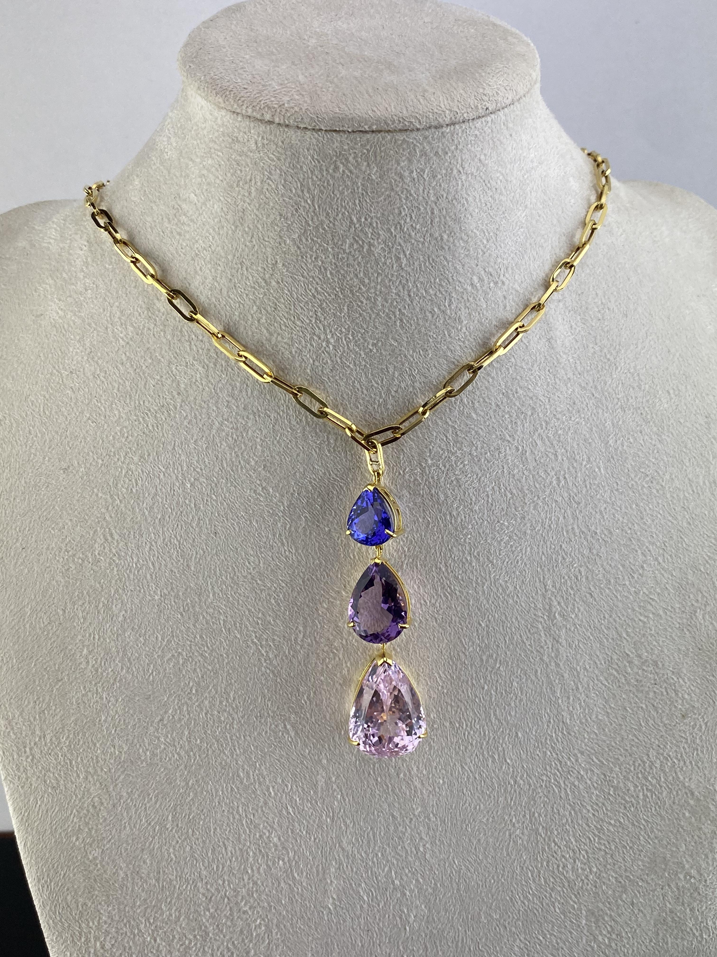 Purple Raindrop 47.50ctw Tanzanite, Amethyst, and Kunzite Three-Stone Pendant Necklace in 18k Yellow Gold

Exude undeniable elegance with this beautiful 3-stone pendant necklace, finely crafted in brightly polished 18k yellow gold. Hand-selected