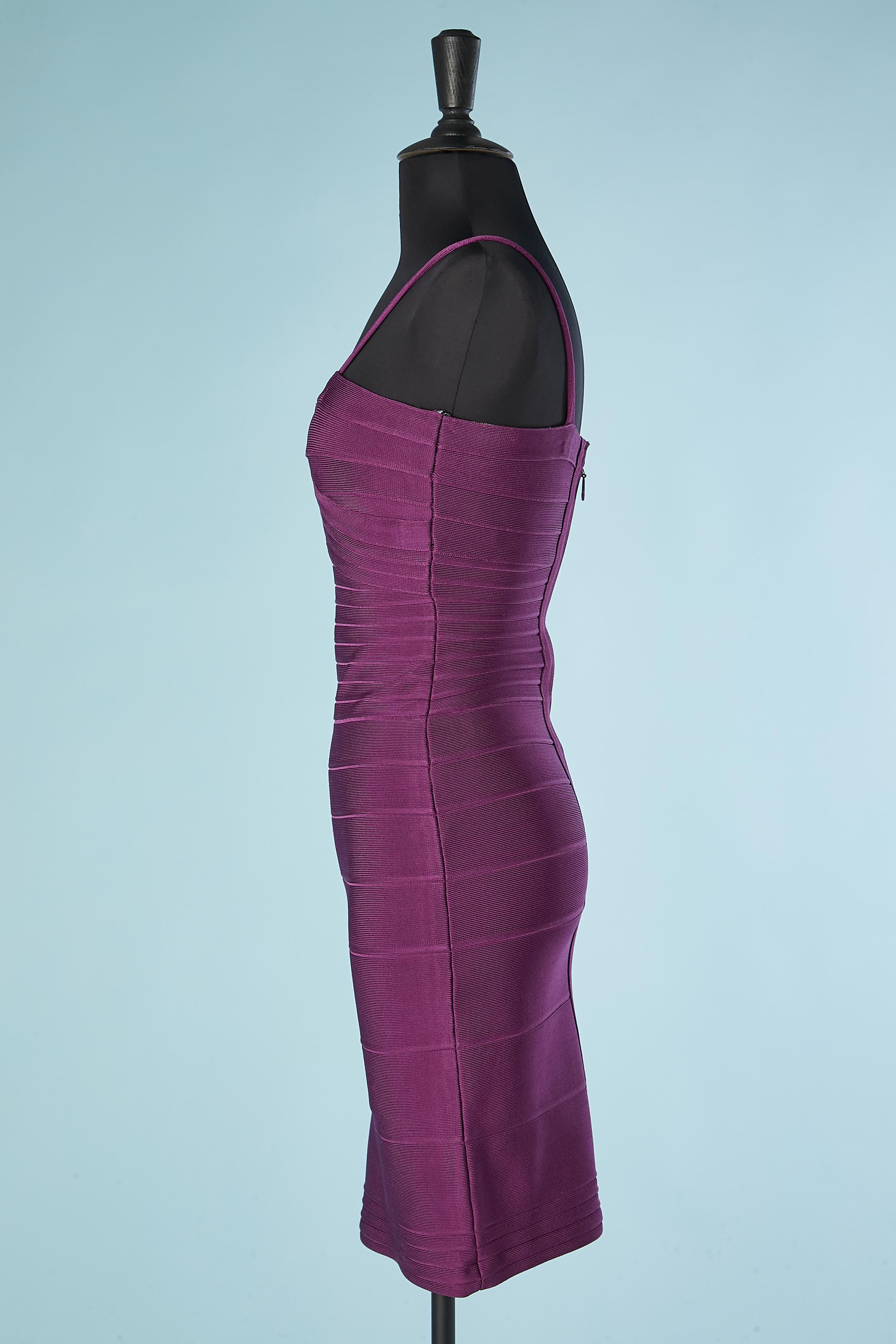 Purple rayon cocktail dress. Silicone on the inside edge of the bustier. Zip middle back. Fabric composition: 90% rayon, 9% nylon, 1% spandex. 
SIZE XS  