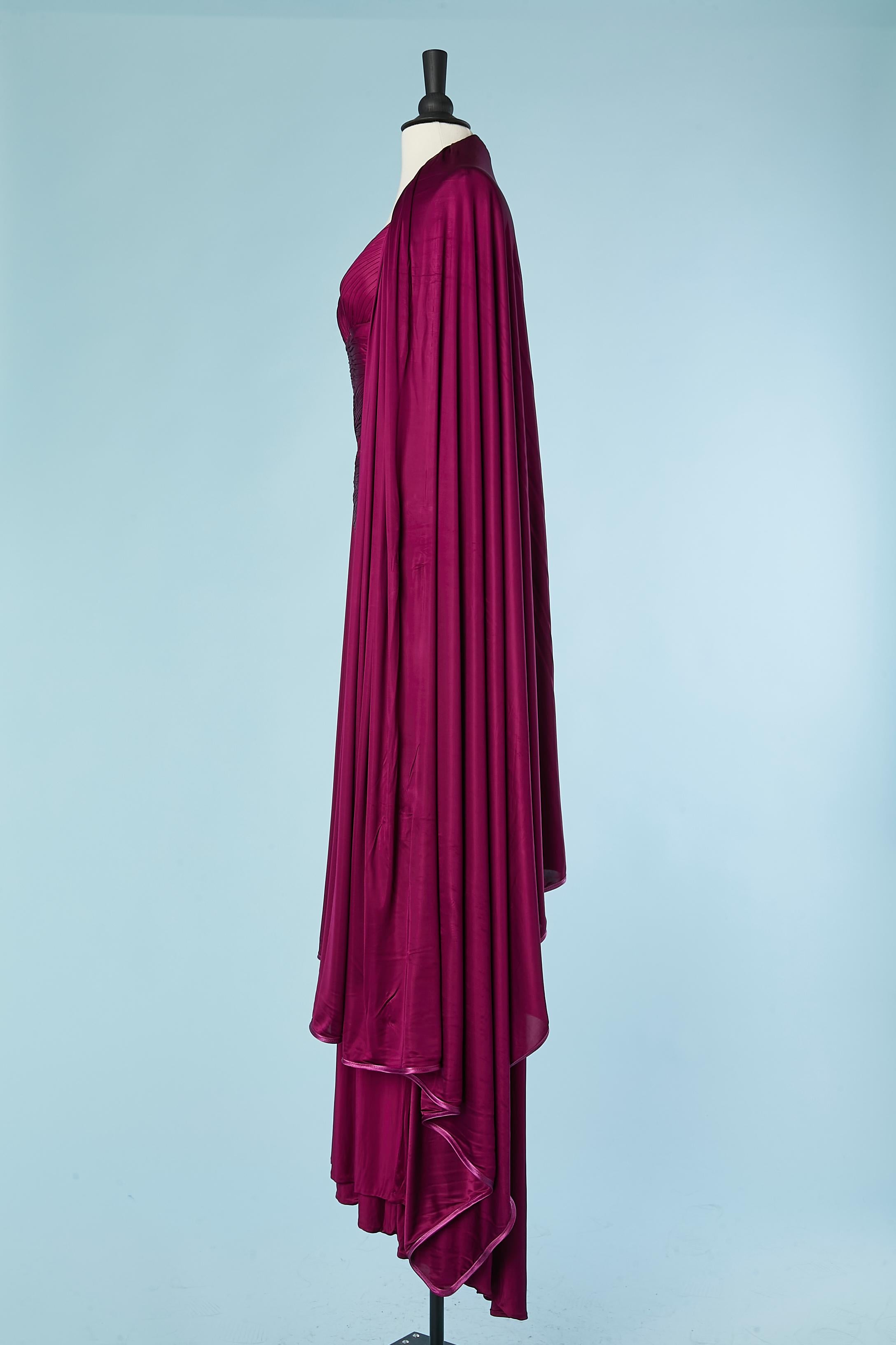 Purple rayon jersey backless draped evening dress with shawl. Wrap in the front. Body-suit inside in skin-tone tulle .Invisible zip on the right side. Boned. Padded bra. Size of the shawl= 180 cm X 275 cm. 
SIZE S