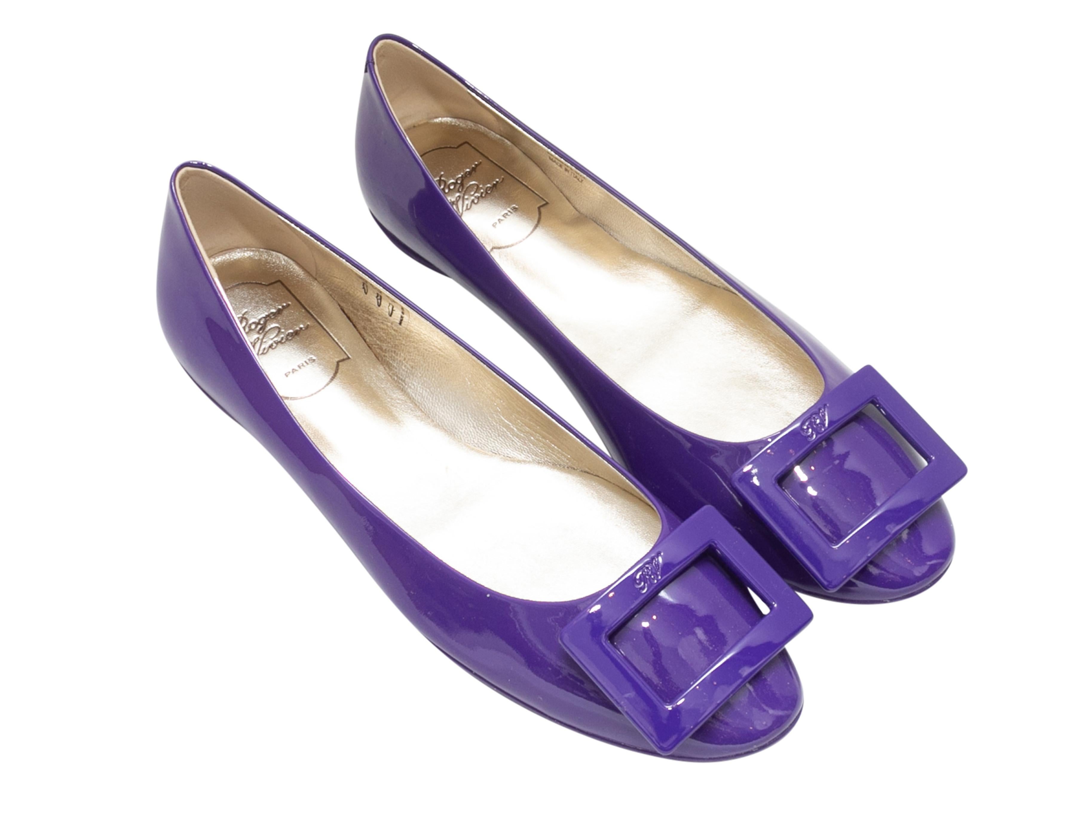 Purple patent leather Gommette ballet flats by Roger Vivier. Buckle accents at tops.