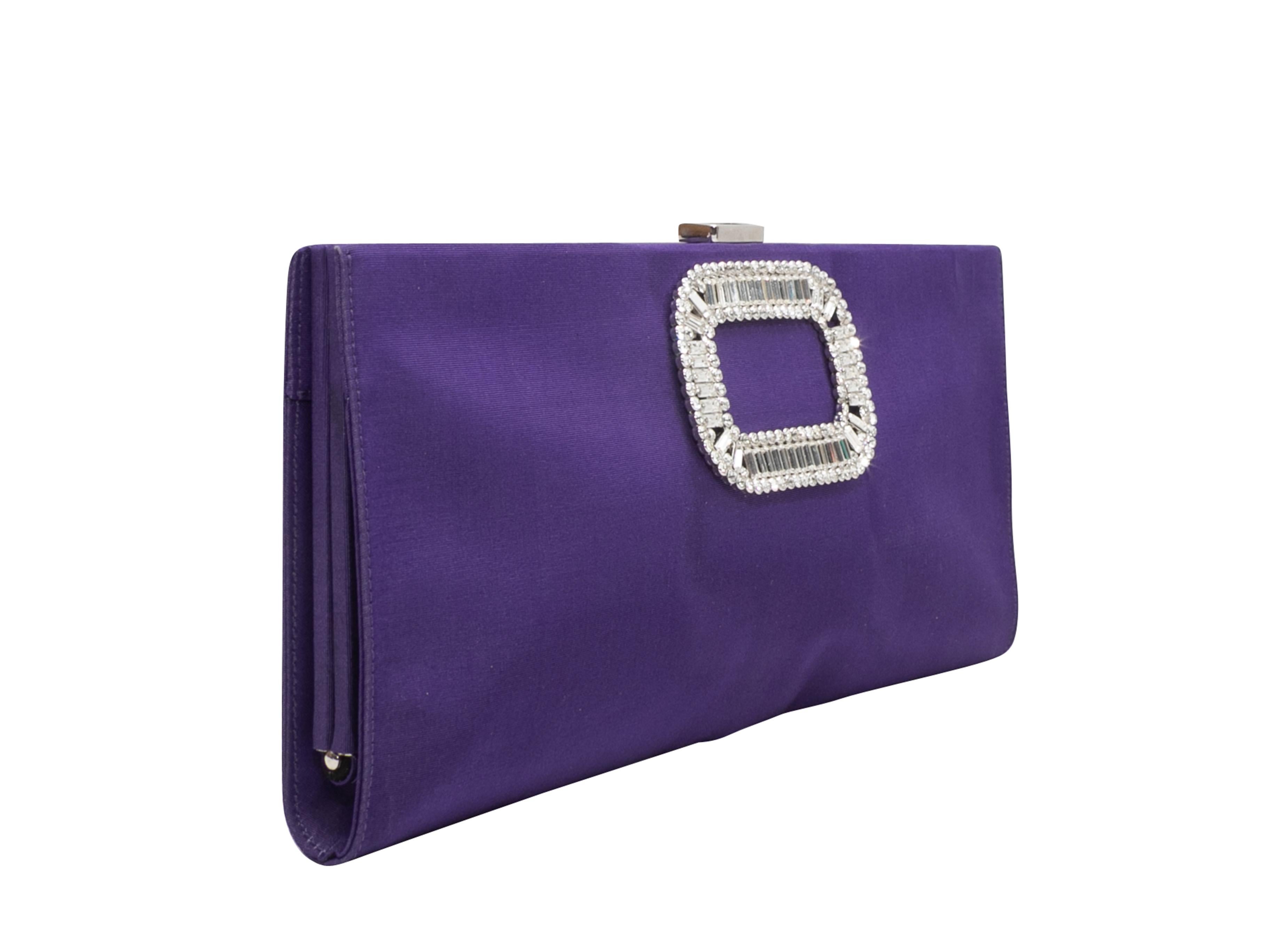 Purple Roger Vivier Satin Crystal-Embellished Clutch. This clutch features a satin body, silver-tone hardware, a Strass crystal-embellished buckle adornment at front, and a top clasp closure. 10.75