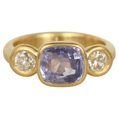 Purple Sapphire and Diamond Three-Stone Bezel Ring