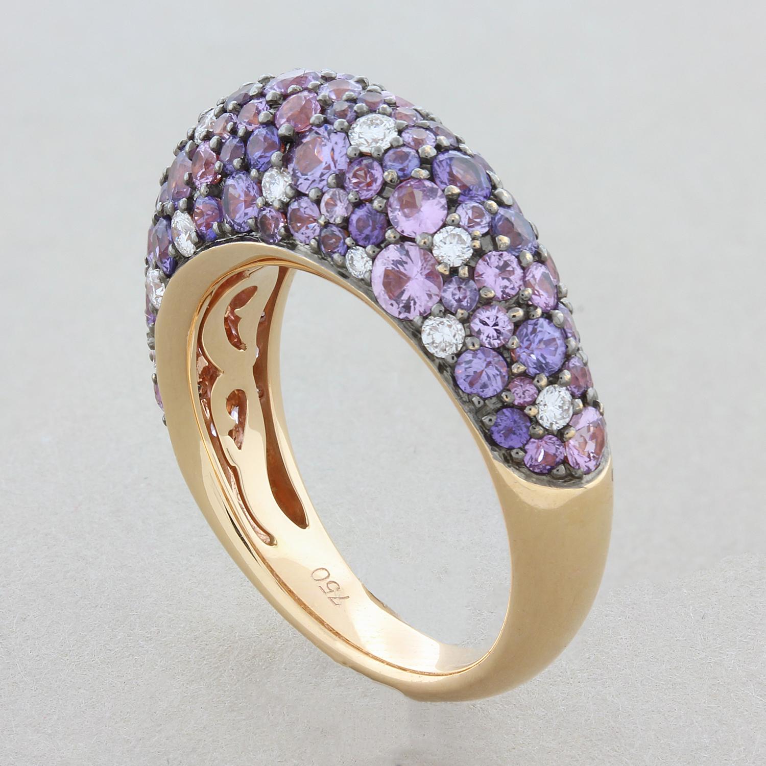 This luscious dome ring features 2.85 carats purple sapphire in different tones from deeper to light colors. They are accented by 0.33 carats of round brilliant cut diamonds. The pave set round cut stones are set in 18K rose gold.

Ring Size 6.5