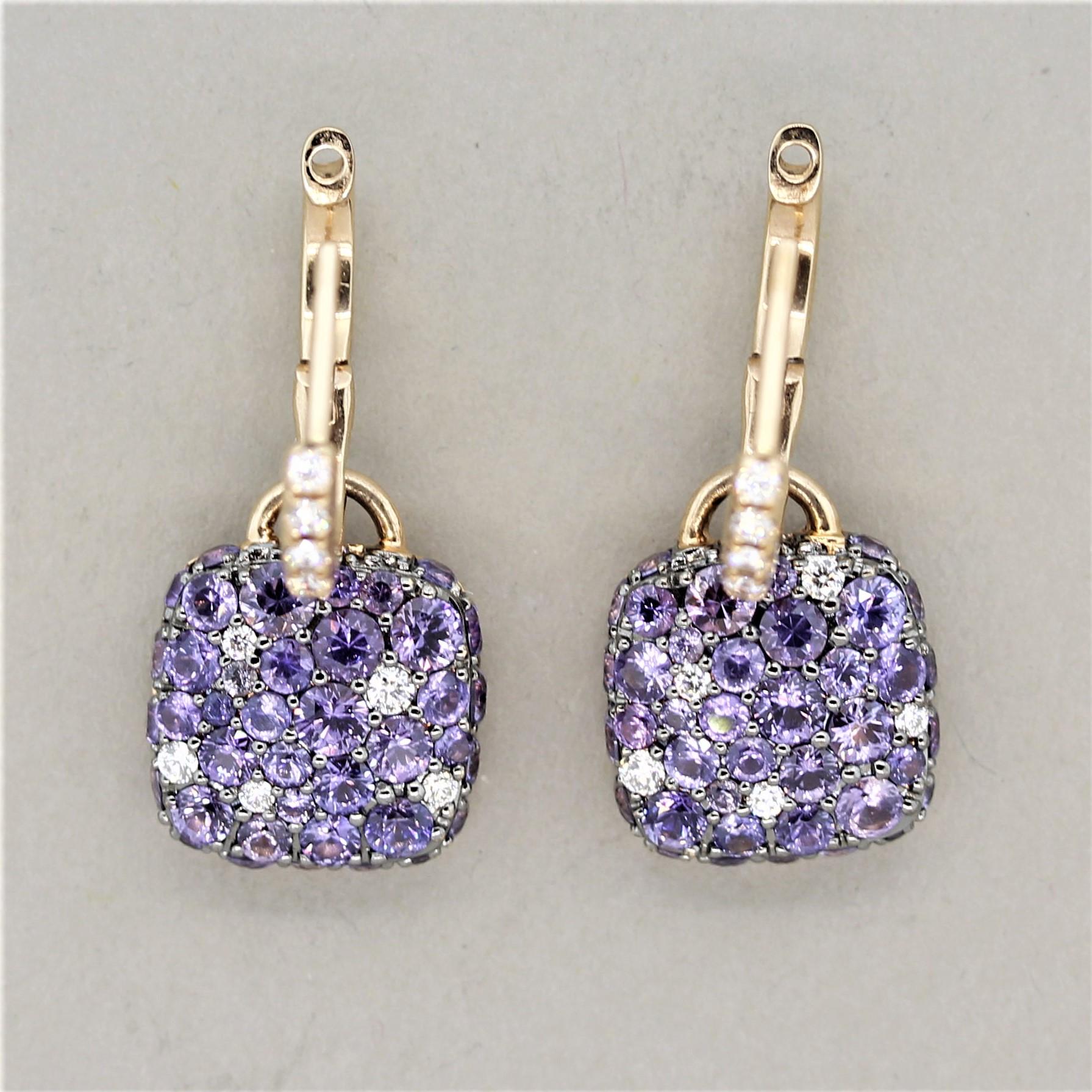 A fun and fashionable pair of earrings! They feature 4.60 carats of round cut fancy sapphires which have various shades of purple! The colors of the sapphires range from purple to pink and contrast with each other. Adding to that are 0.34 carats of