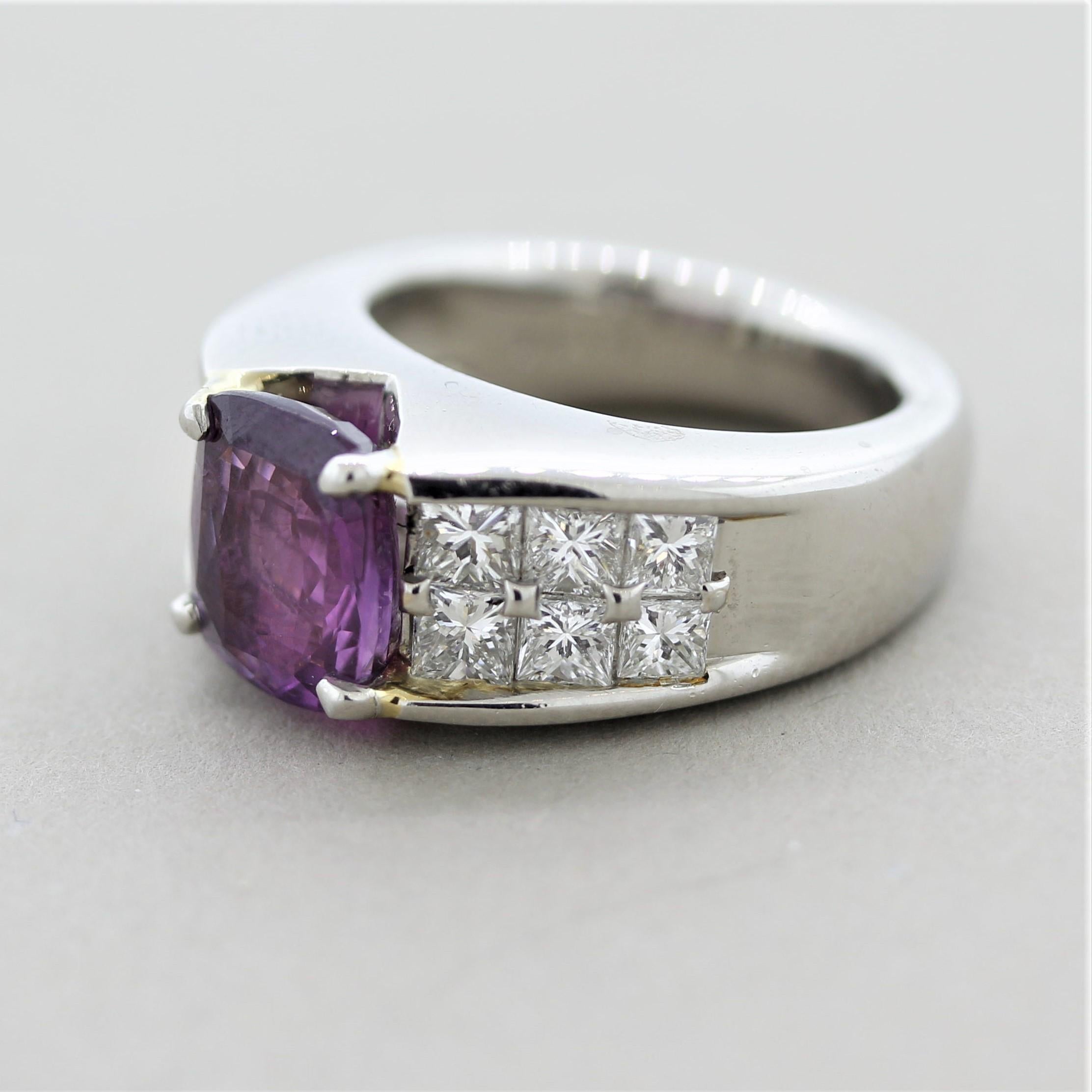 Wow! A stunning heavy platinum ring featuring a gem purple sapphire weighing 3.09 carats. It is cushion shaped and has a bright and vivid purple color. It is accented by 1.47 carats of large princess-cut diamonds set on the shoulders of the ring.