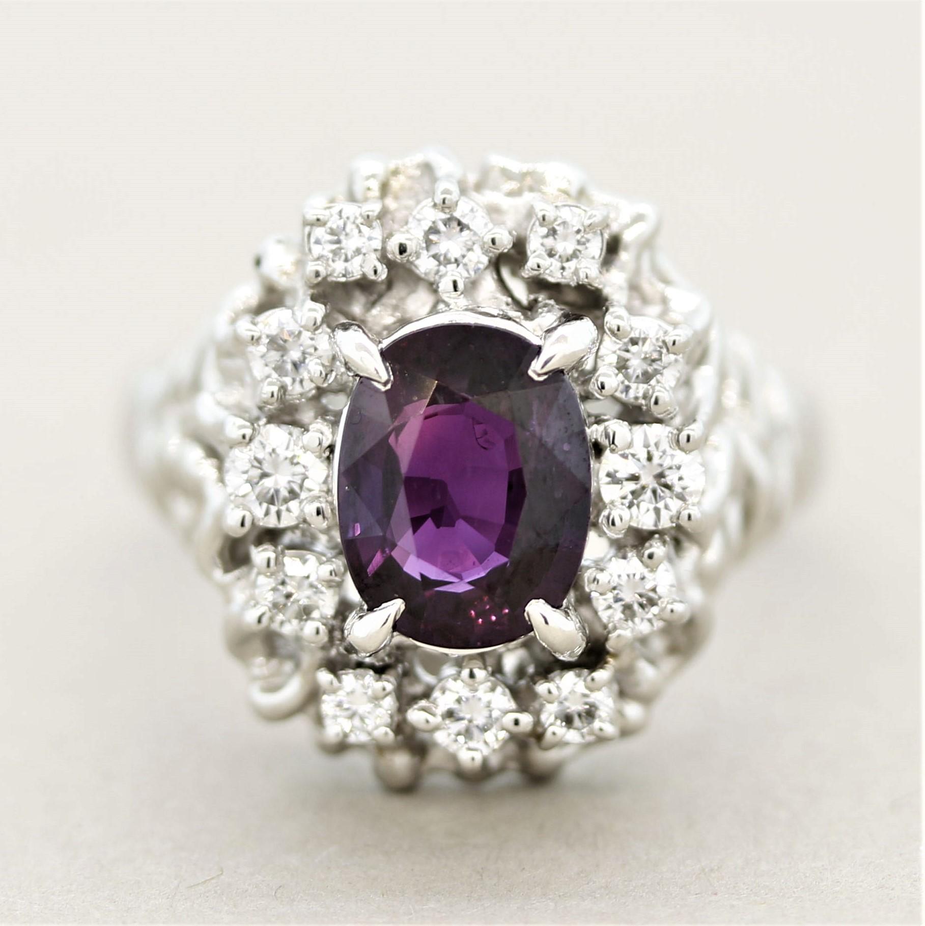 Featuring an extra fine purple sapphire, this sleek platinum ring is one of our favorites! The gem sapphire weighs 2.18 carats and has a bright vivid purple color with excellent brilliance which is due to its fantastic cutting as well as it being