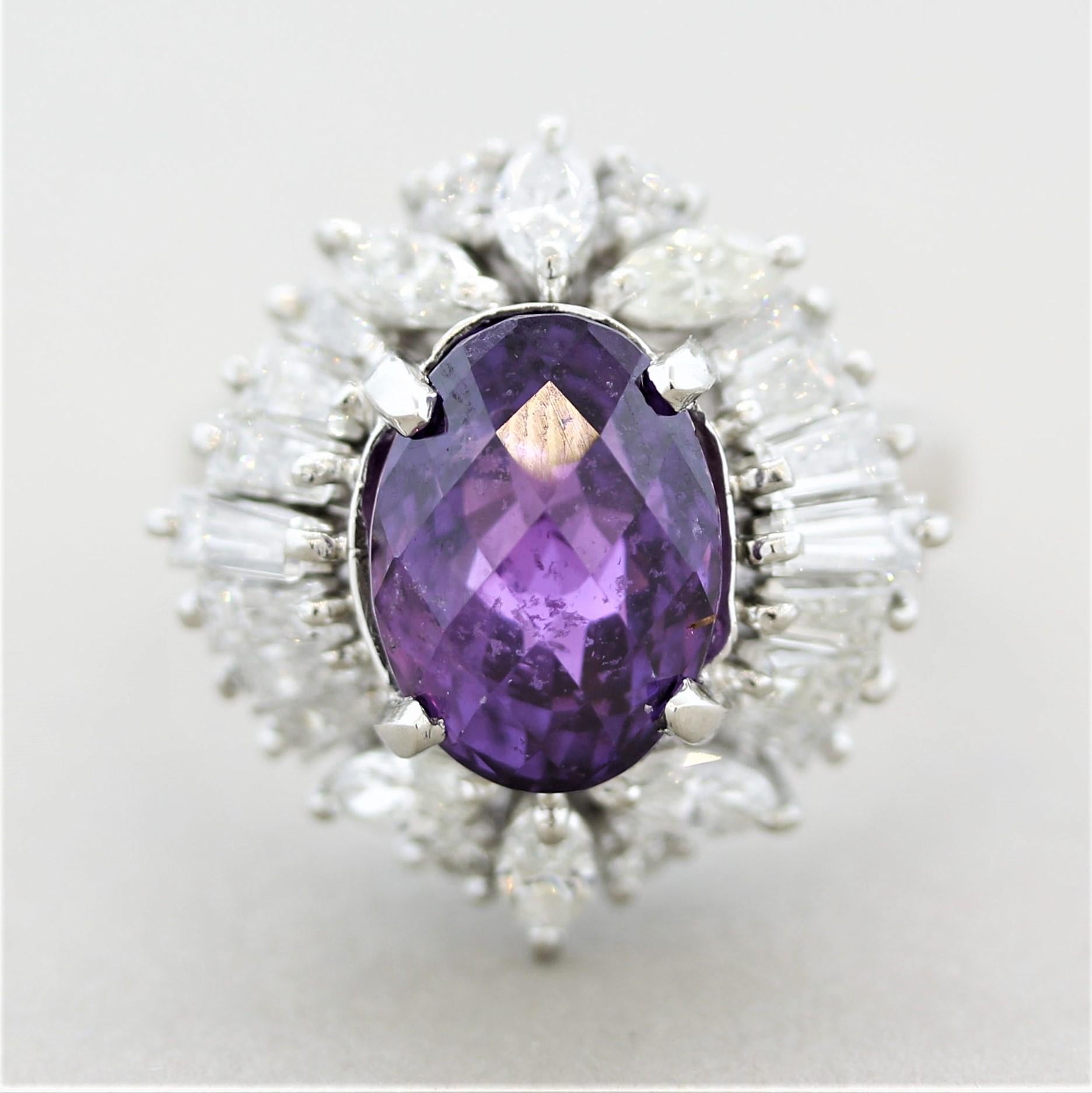 A large and impressive sapphire! It weighs 6.80 carats and has a royal vivid purple color that mesmerizes whoever gazes into it! It has a beautiful oval shape with a unique rose-cut. Accenting the sapphire are 2.00 carats of fine round, baguette,