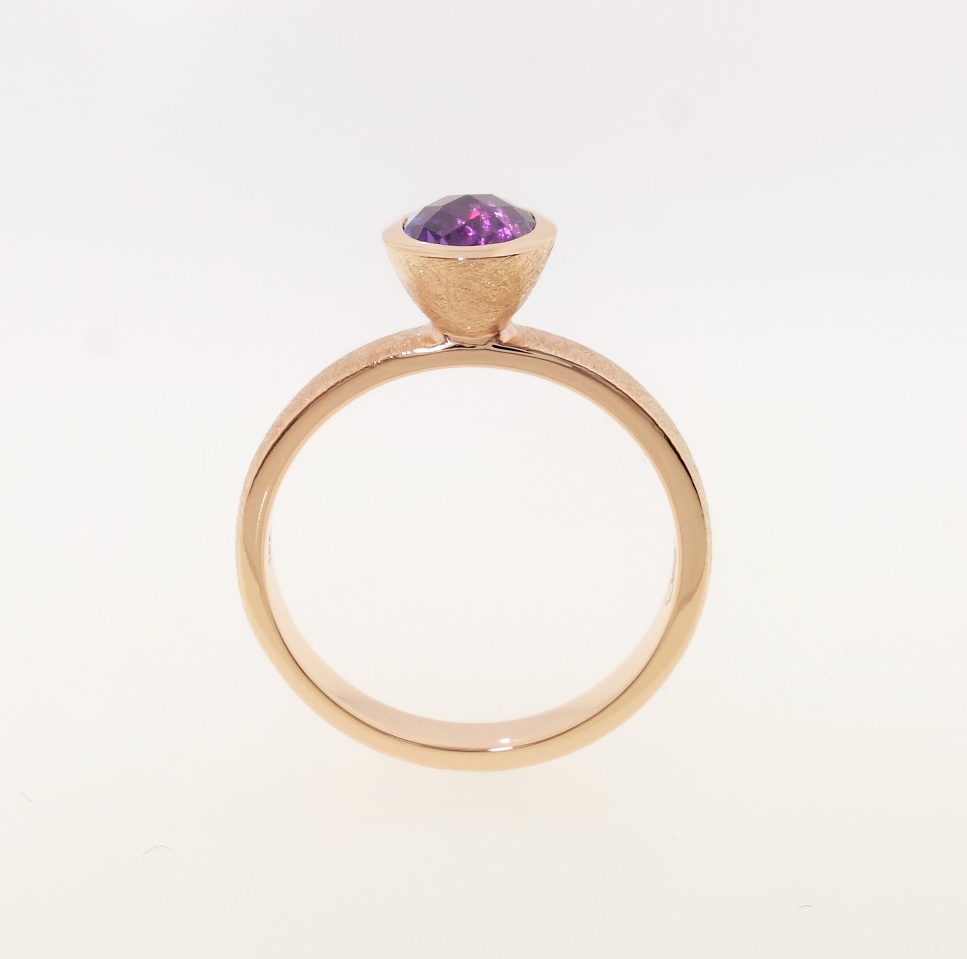 Simply Beautiful, Elegant and finely detailed Stacking Ring, set with an oval Purple Sapphire, weighing approx. 1.56 Carats and measuring 7.4mm x 5.5mm. Hand crafted and Hand Textured in 18 Karat Yellow Gold. The ring epitomizes vintage charm,