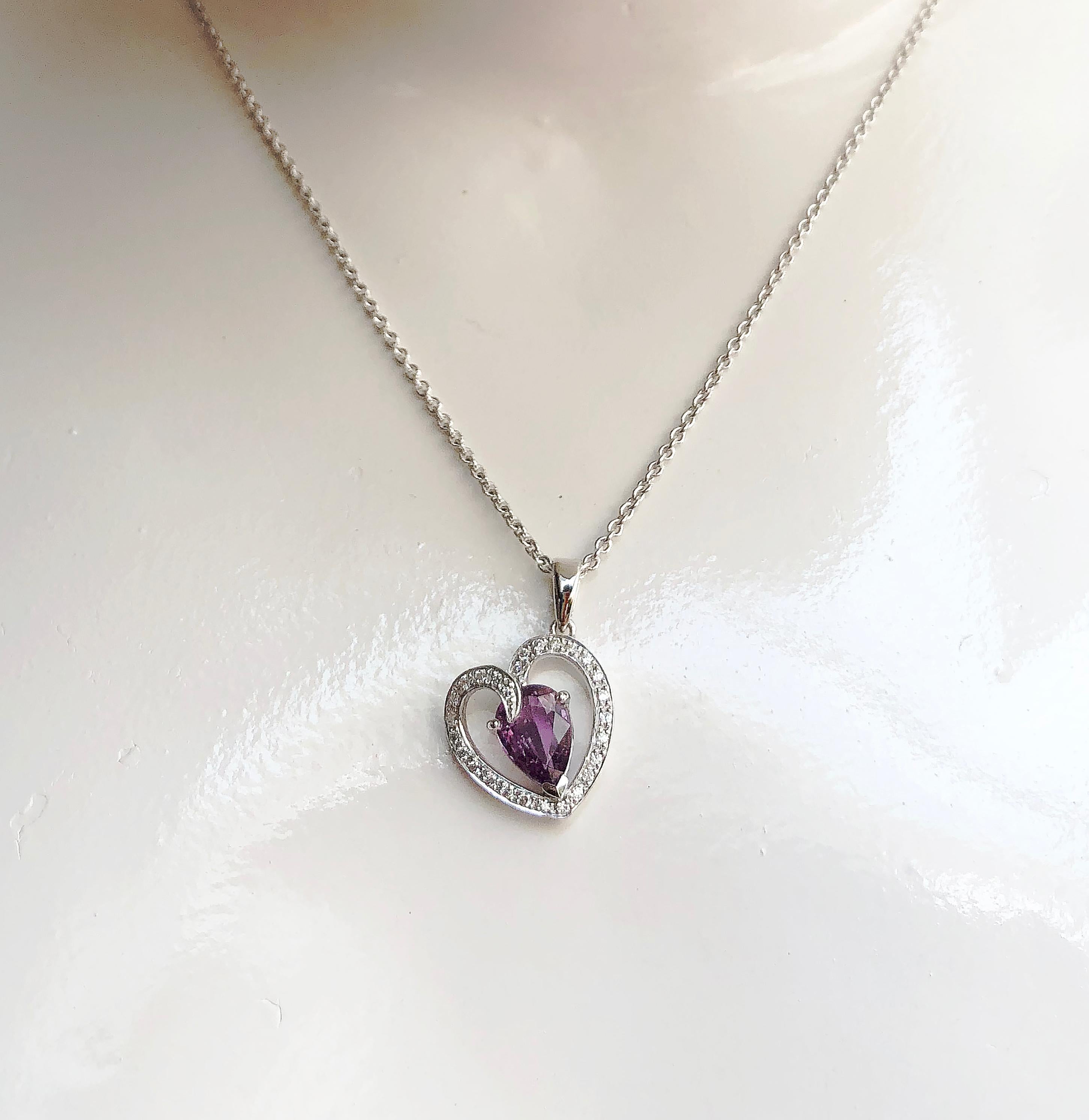 Purple Sapphire 1.35 carats with Diamond 0.13 carat Pendant set in 18 Karat White Gold Settings
(chain not included)

Width: 1.5 cm
Length: 2 cm 


