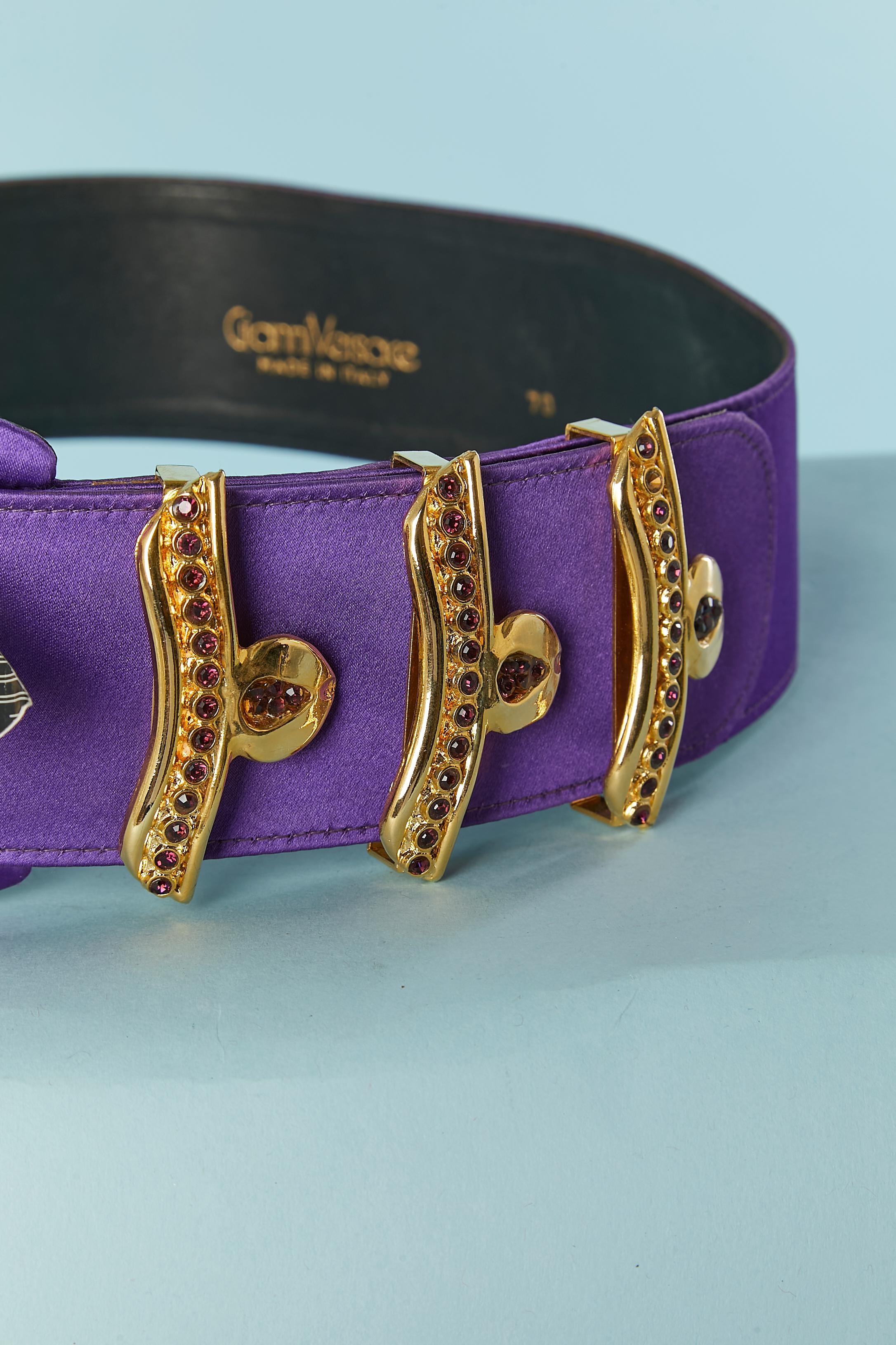 Purple satin belt with gold metal belt-lop and red rhinestone embellishment.  Black leather lining. 
SIZE 70
Total lenght : 95 cm 
Width: 5,5cm 
NEW with tag 