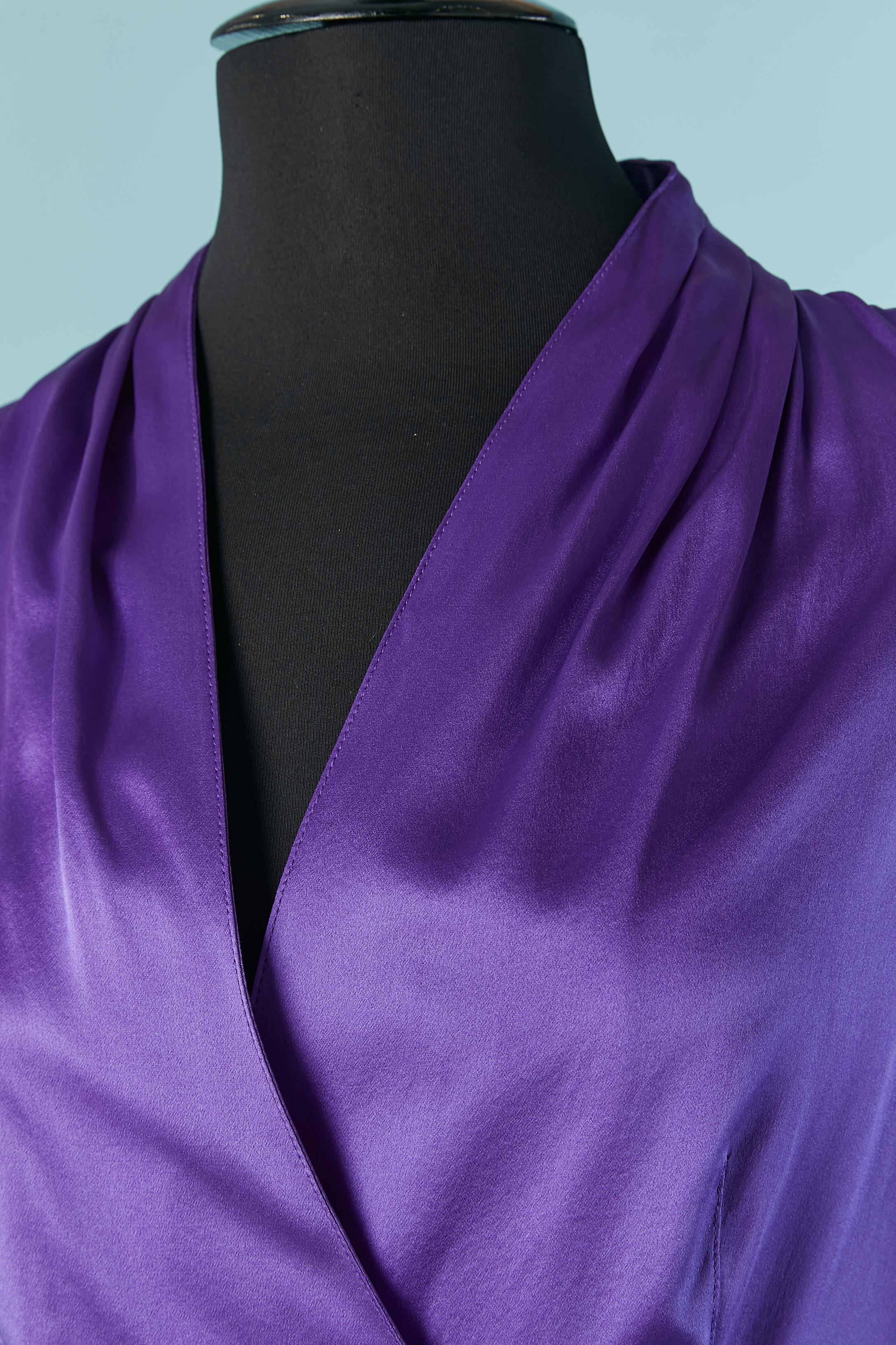 Purple silk wrap shirt. Silver snap closure on the waist and on the cuffs. 
Draped collar. New with tag.
SIZE 42 (Fr) L 