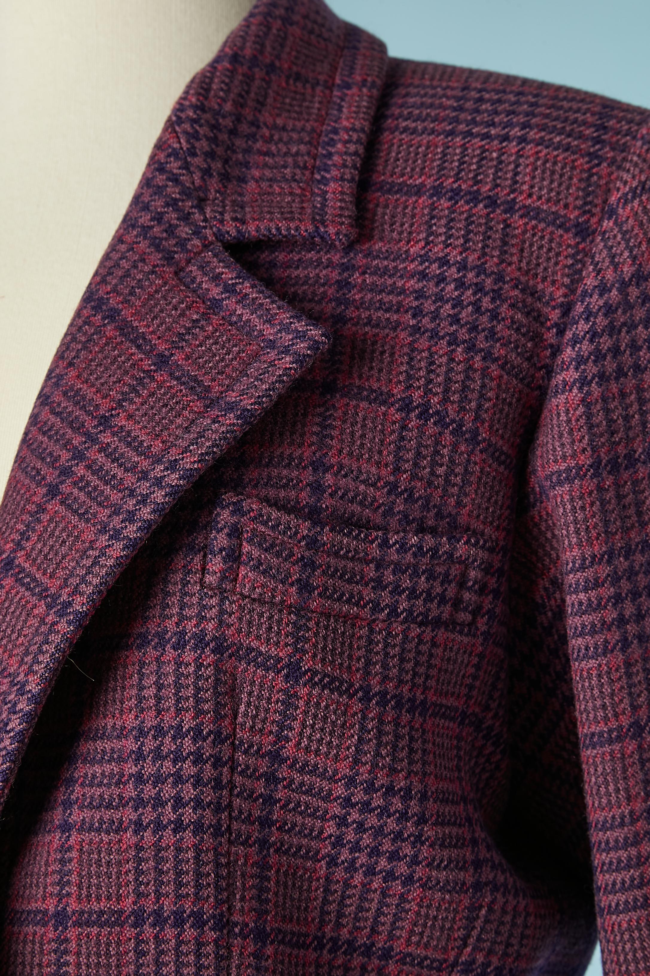 Purple single breasted wool jacket with check pattern. No fabric tag but lining is probably rayon. Shoulder pad. 
SIZE 42 (Fr) 12 (US) 