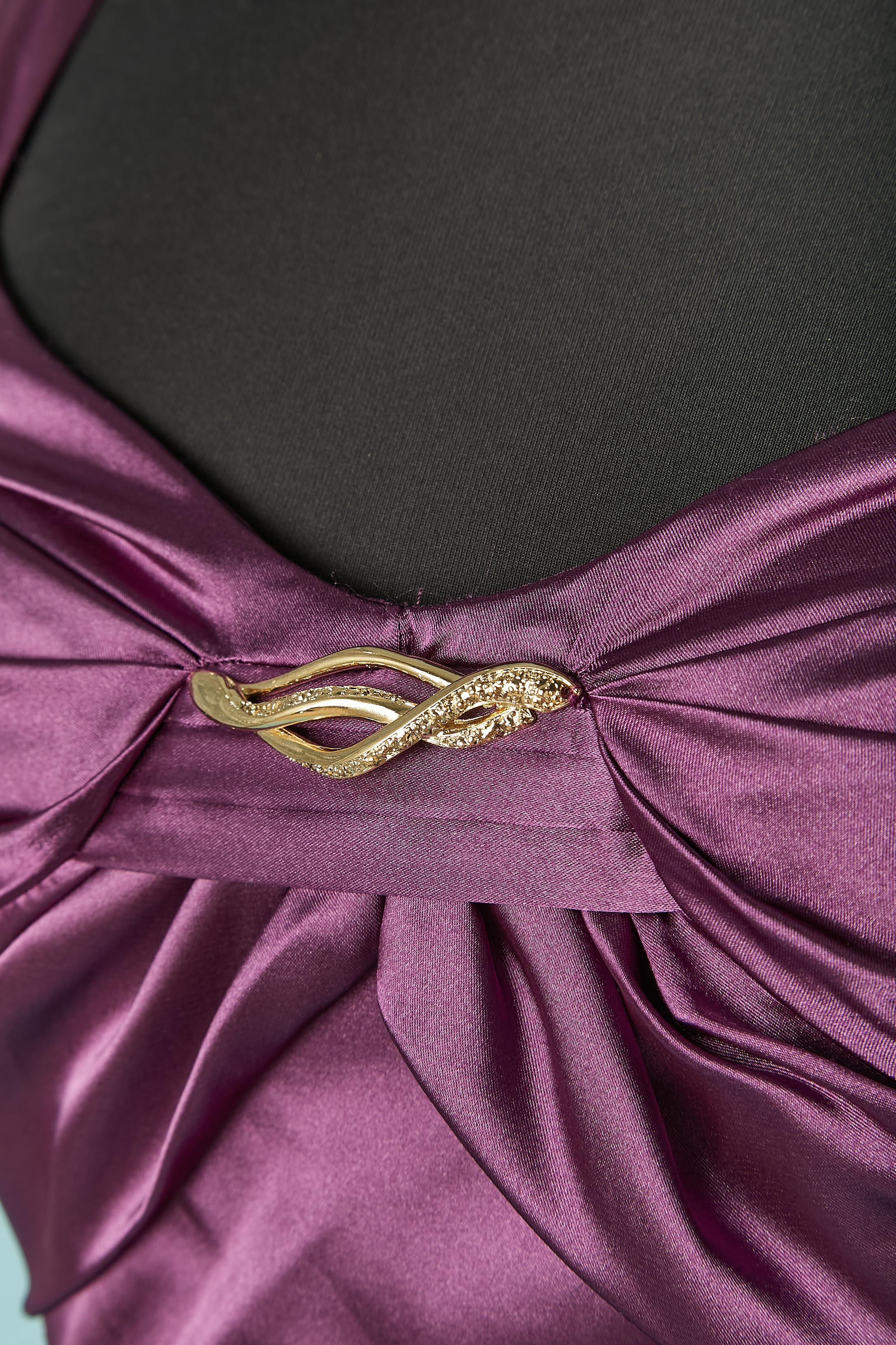 Purple sleeveless cocktail dress . Fabric composition: 97% polyester, 3% elastane. 
Invisible zip closure on the left side. Draped on the bust with a gold metal jewellery embellishment on . 
SIZE 44 (It) 40 (Fr) 8 (US) 