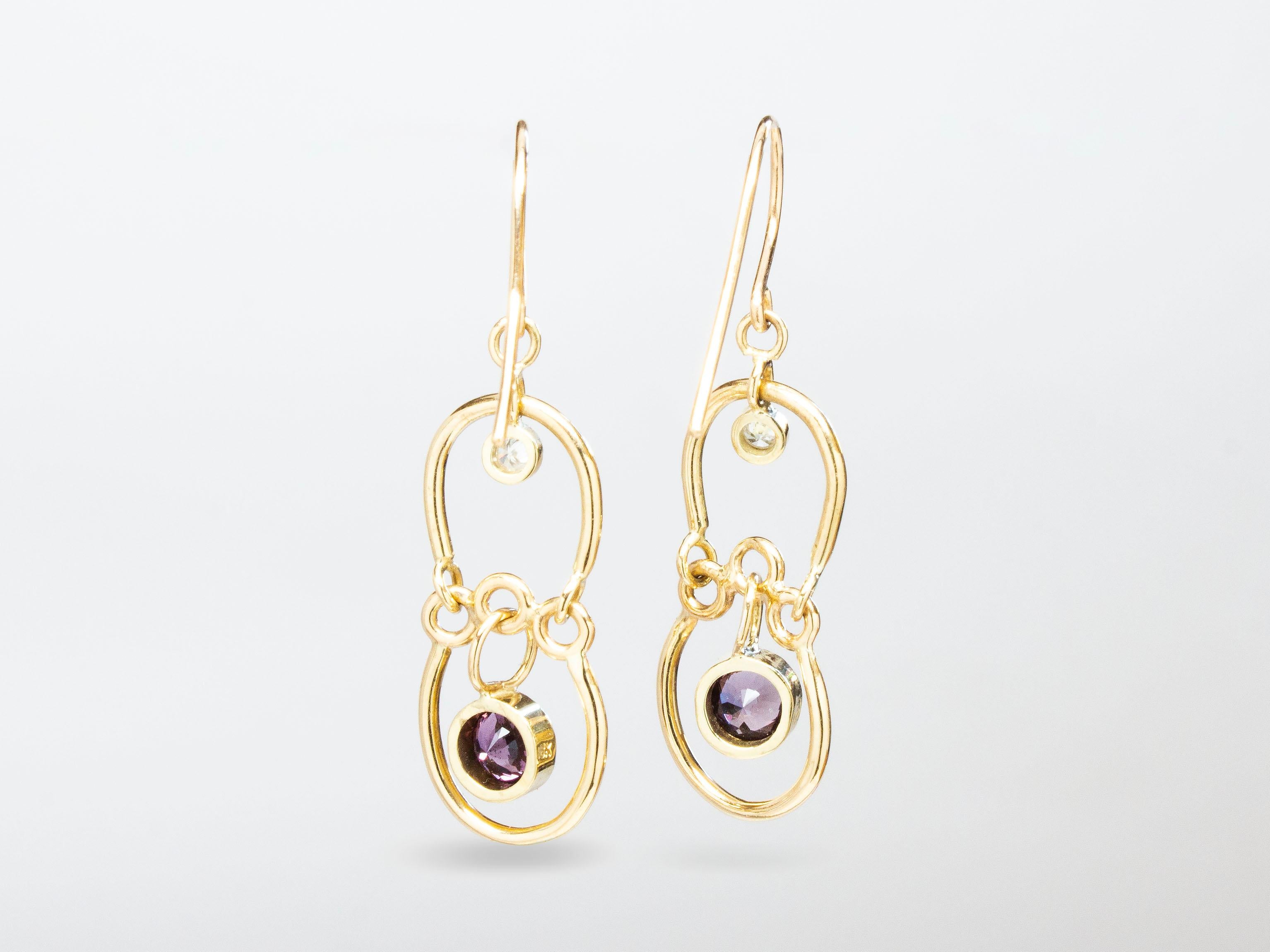 The Dangle Earrings with Purple Spinel from modern fine jewelry house, Baker & Black. Petite drop earrings with the perfect mix of movement, color, and sparkle. 

• purple spinel
• white diamonds, weighing .06cttw
• measure 38mm (1 ½