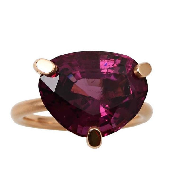 A beautiful shield shape natural purple spinel set in 18kt rose gold. The spinel weighs 10.91 carats and accompanies a gemological report, size 6 1/2 US.