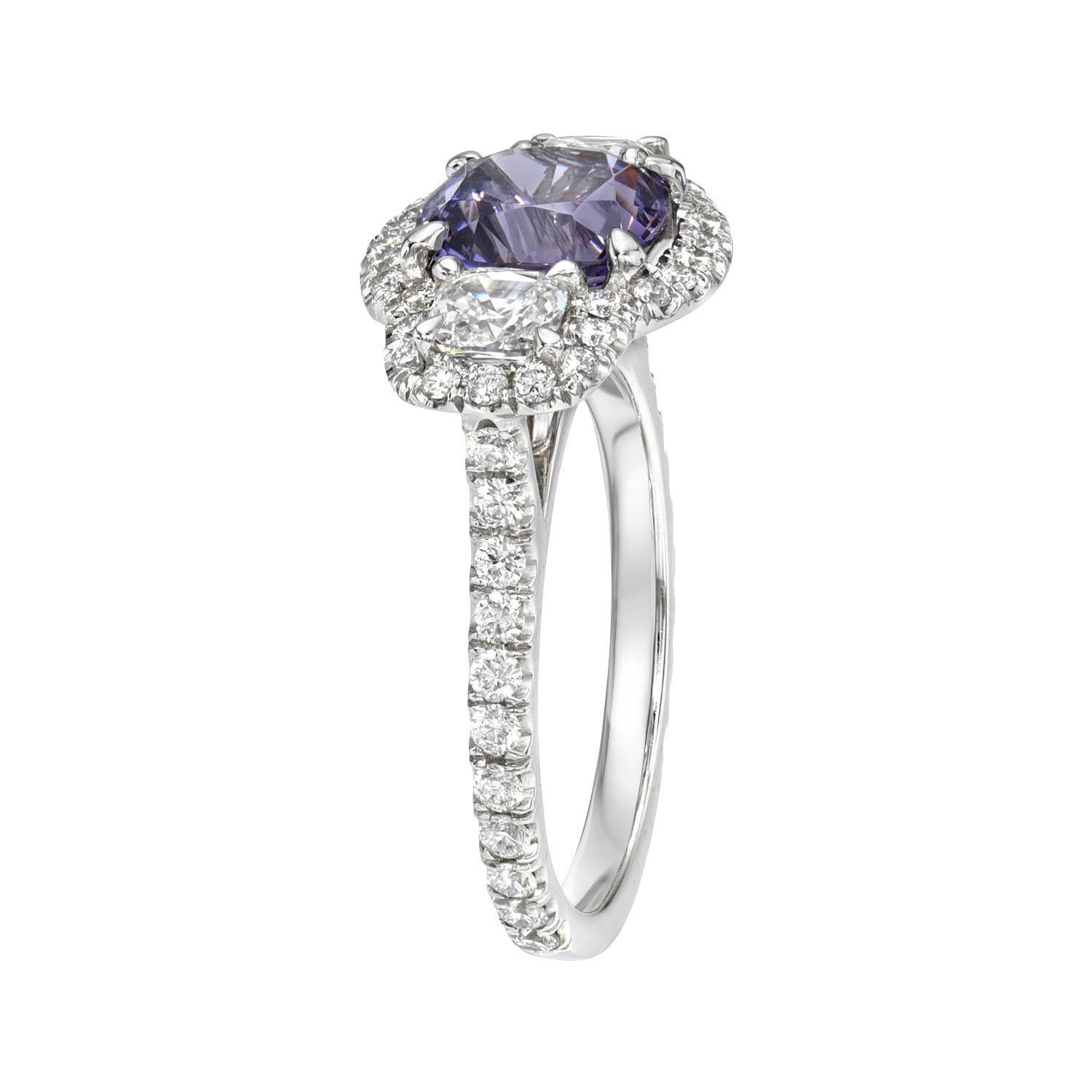 Vivid 2.30 carat natural Lavender Spinel cushion, three stone platinum ring, flanked by a pair of 0.68 carat, F/VS cushion diamonds and a total of 0.58 carats of round brilliant diamonds.
Ring size 6. Resizing is complementary upon request.
Returns