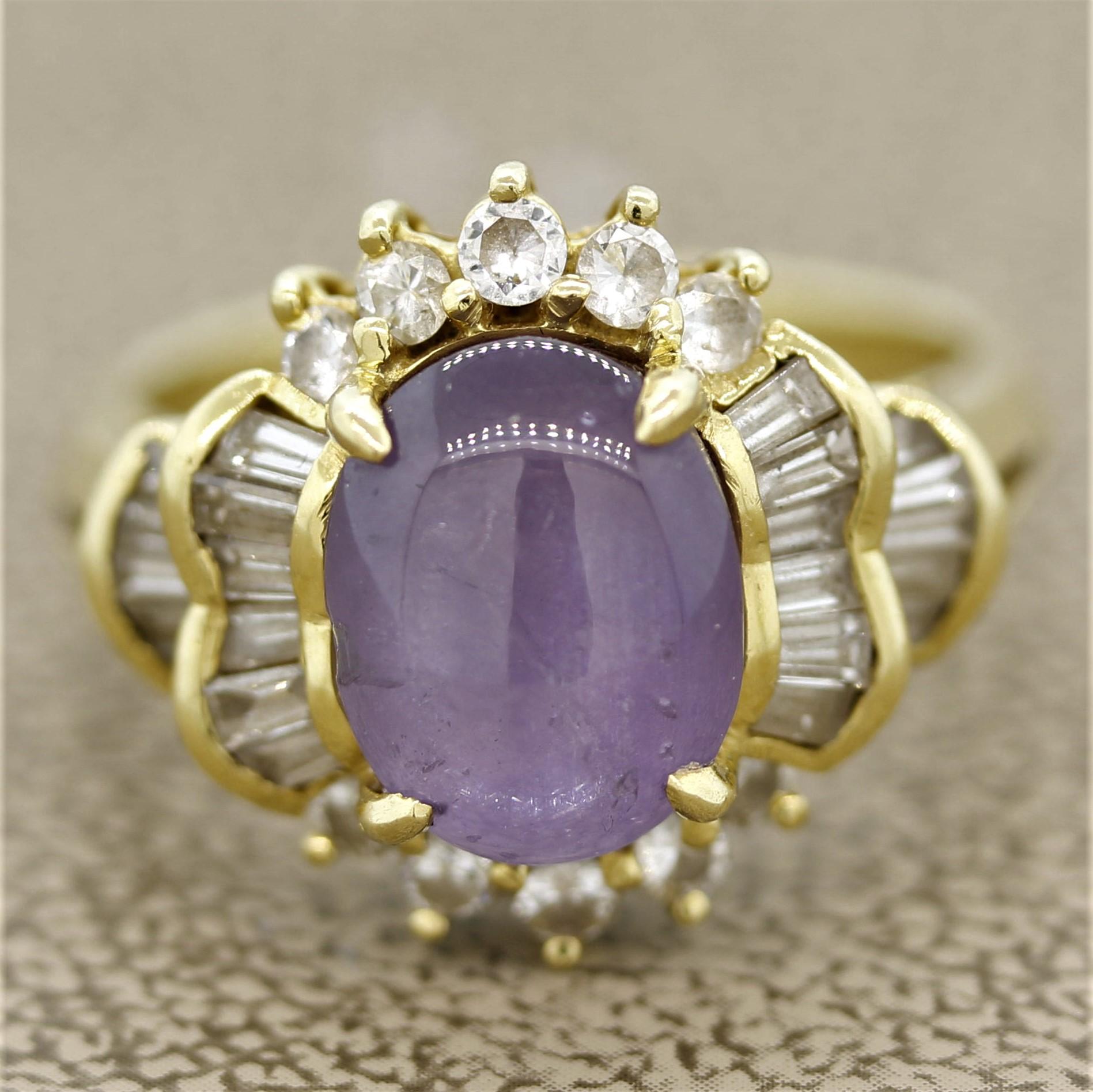 A lovely ring featuring a 6.71 carat star sapphire. The sapphire has a unique purple color with a hint of pink in it. When a light hits the stone a six rayed star can be seen across its surface (known as asterism). It is complemented by 1.01 carats