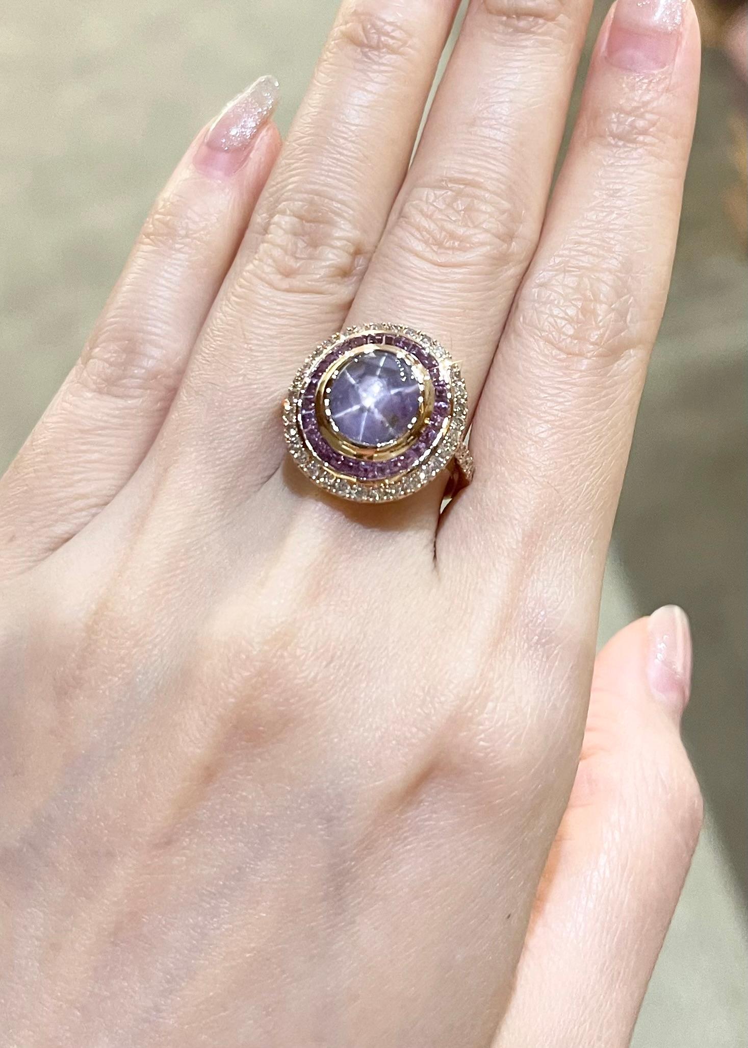 Purple Star Sapphire 5.49 carats, Purple Sapphire 2.24 carats and Brown Diamond 0.75 carats Ring set in 18K Rose Gold Settings

Width:  1.8 cm 
Length: 1.9 cm
Ring Size: 53
Total Weight: 10.25 grams

