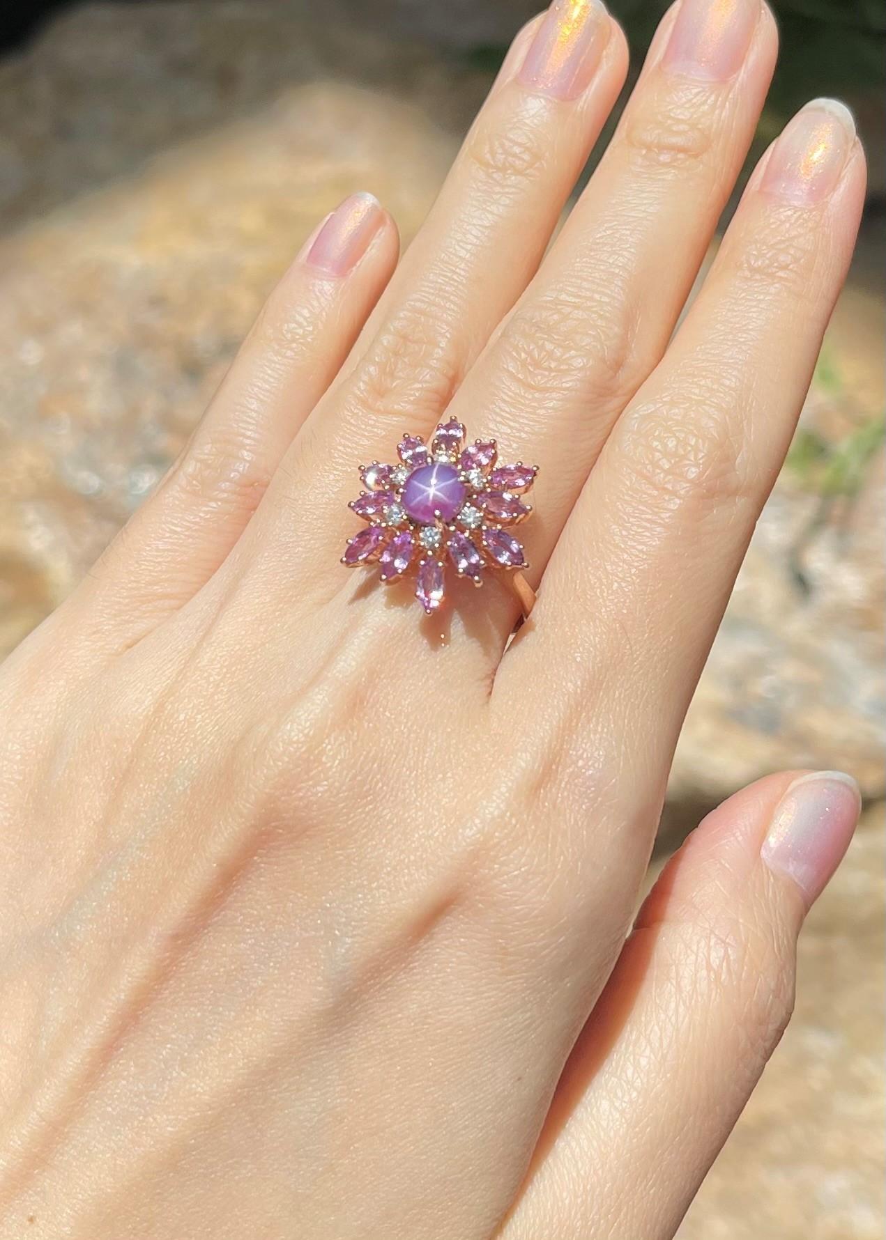 Purple Star Sapphire 1.86 carats, Purple Sapphire 2.09 carats and Diamond 0.19 carat Ring set in 18K Rose Gold Settings

Width:  2.0 cm 
Length: 2.0 cm
Ring Size: 53
Total Weight: 7.23 grams

