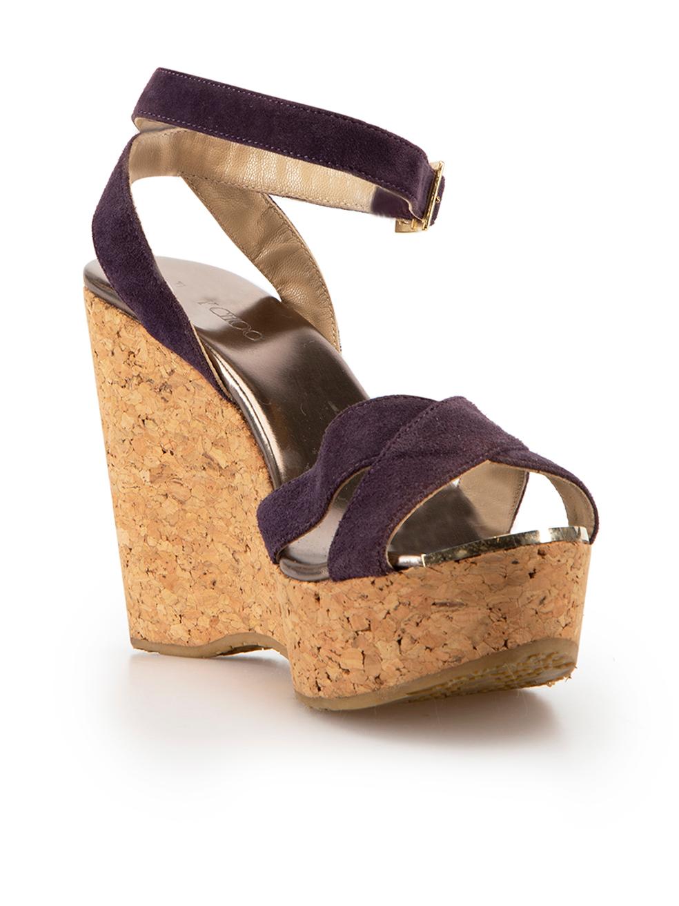 CONDITION is Good. Minor wear to wedge sandals is evident. Light scuffing to suede on straps on this used Jimmy Choo designer resale item.



Details


Purple

Suede

Wedge sandals

Cork wedge

Platform

Open-toe

Wrap around ankle strap



 

Made