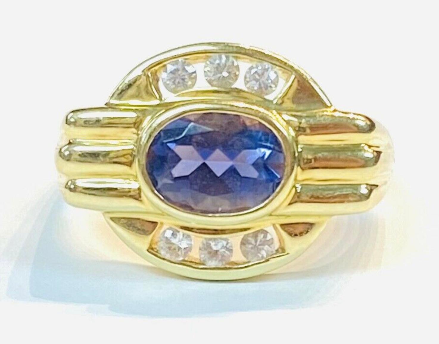 Oval Cut Purple Tanzanite 14K Yellow Gold and Diamond Ring For Sale