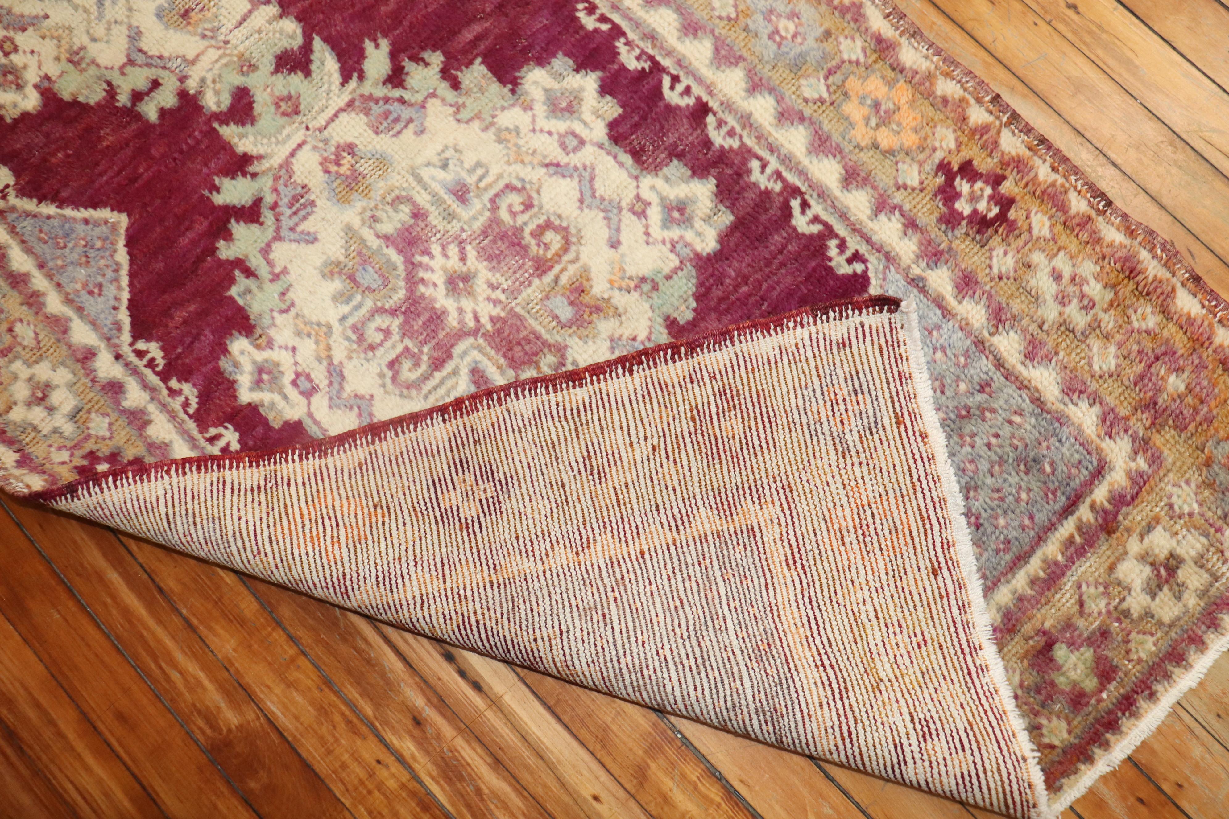 Mid-20th century wool Turkish runner with a geometric design on a deep purple field. 

Measures: 2'10''x 9'10