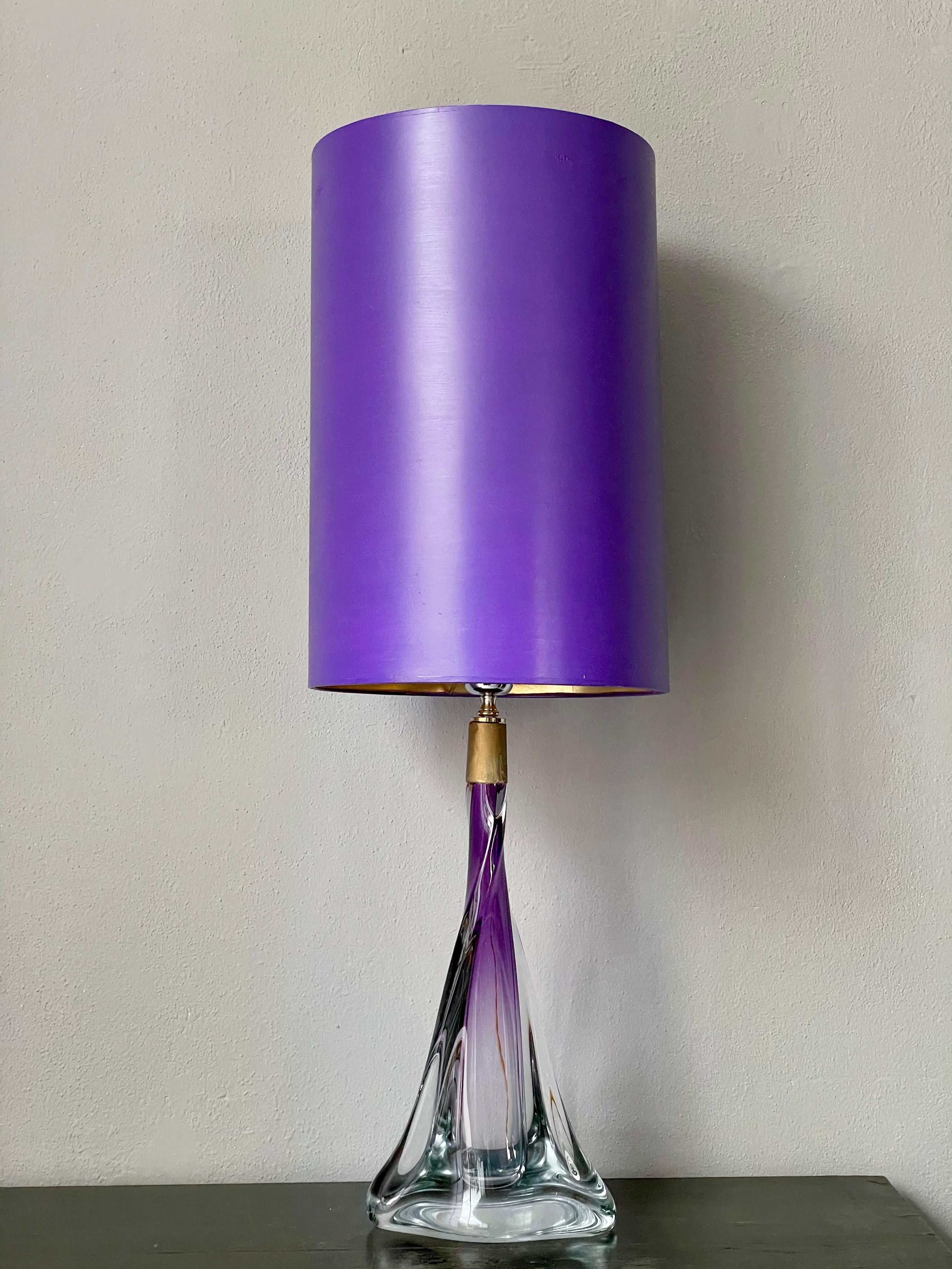 Hand blown purple and clear crystal glass. 
This table lamp was made in France and is signed on the bottom. It has a matching purple shade lined with gold & has been newly electrified by a professional. In very good condition with some small surface